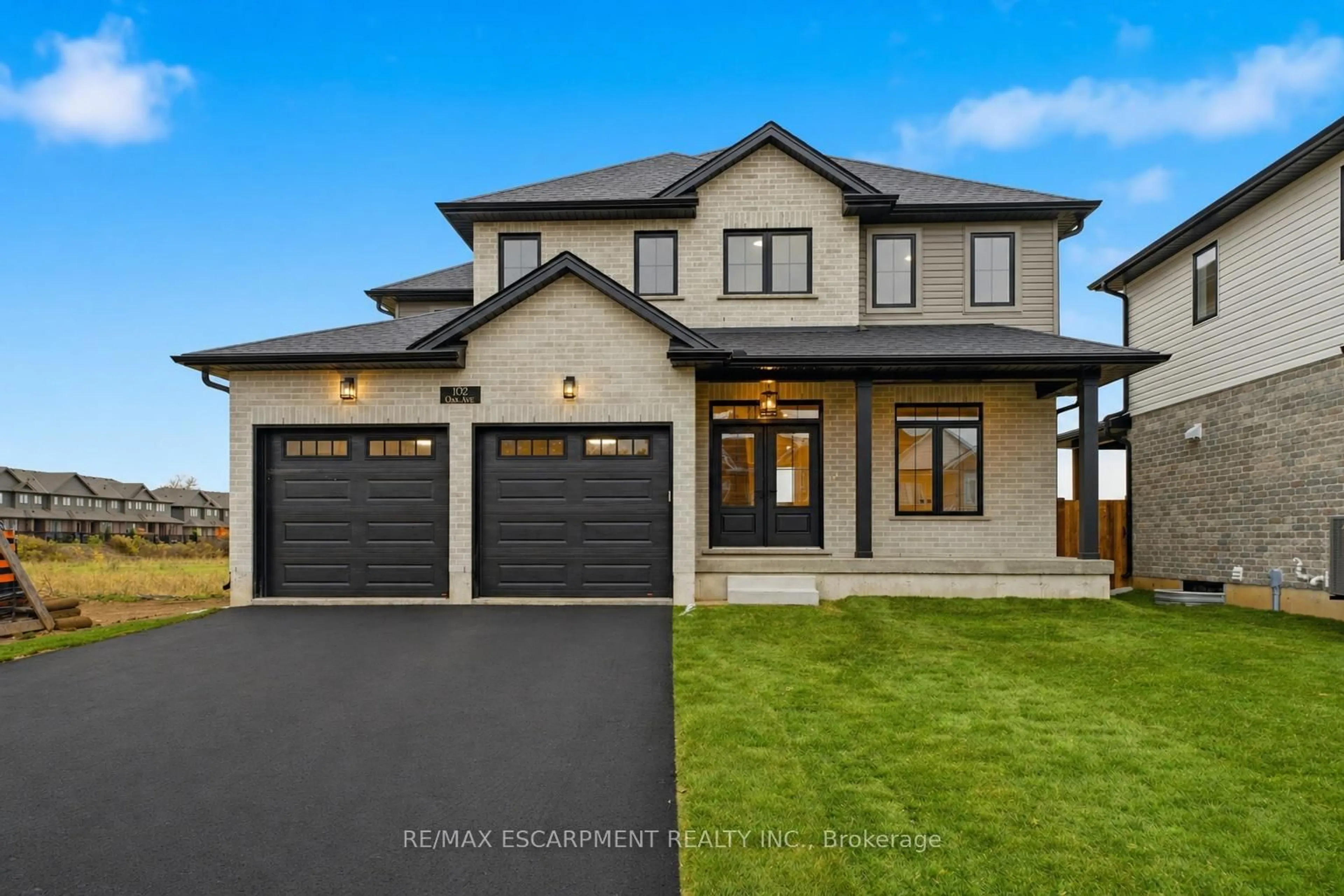 Home with brick exterior material, street for 102 Oak Ave, Brant Ontario N3L 0J6