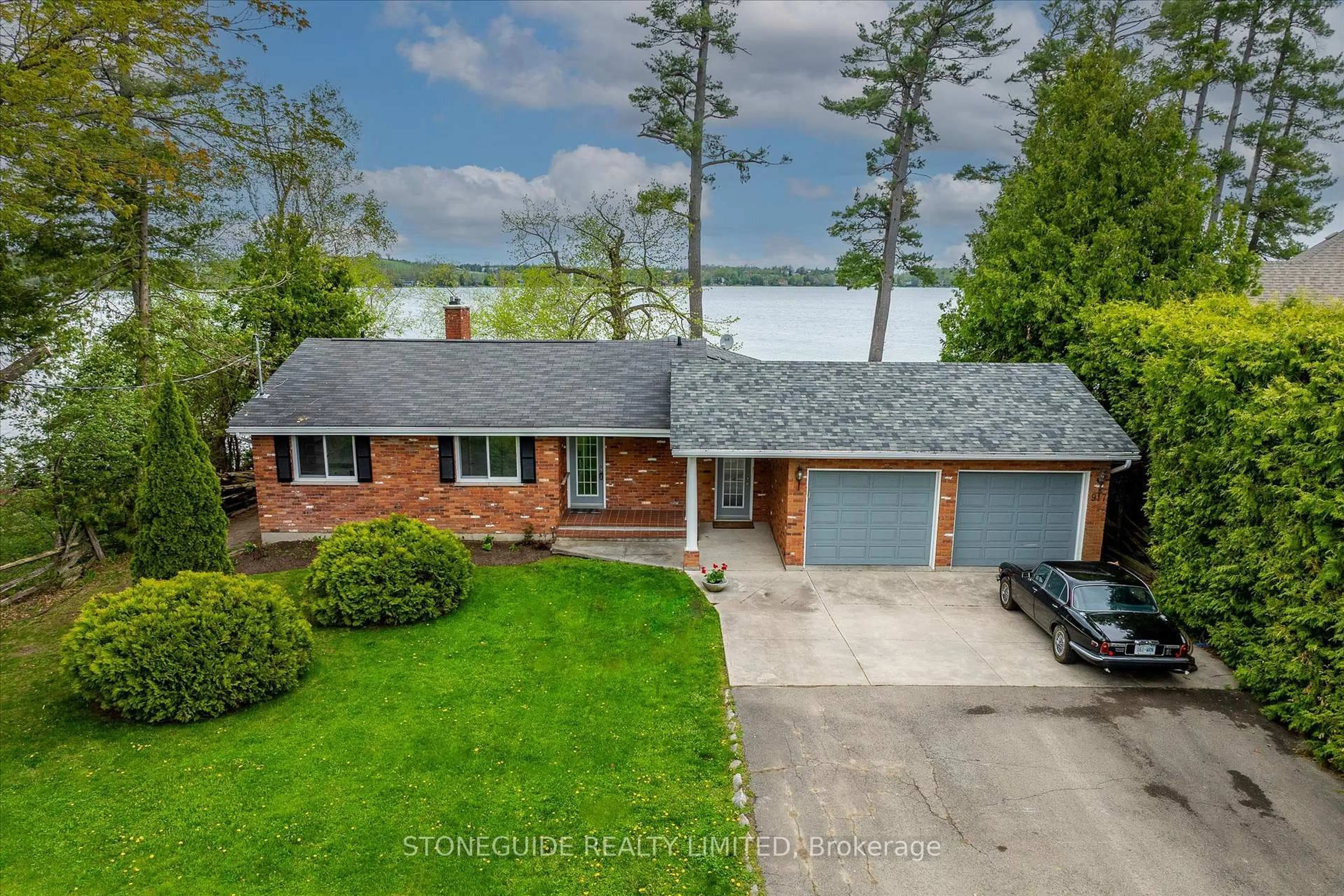 A pic from outside/outdoor area/front of a property/back of a property/a pic from drone, water/lake/river/ocean view for 917 Tindle Crt, Selwyn Ontario K9J 0C5