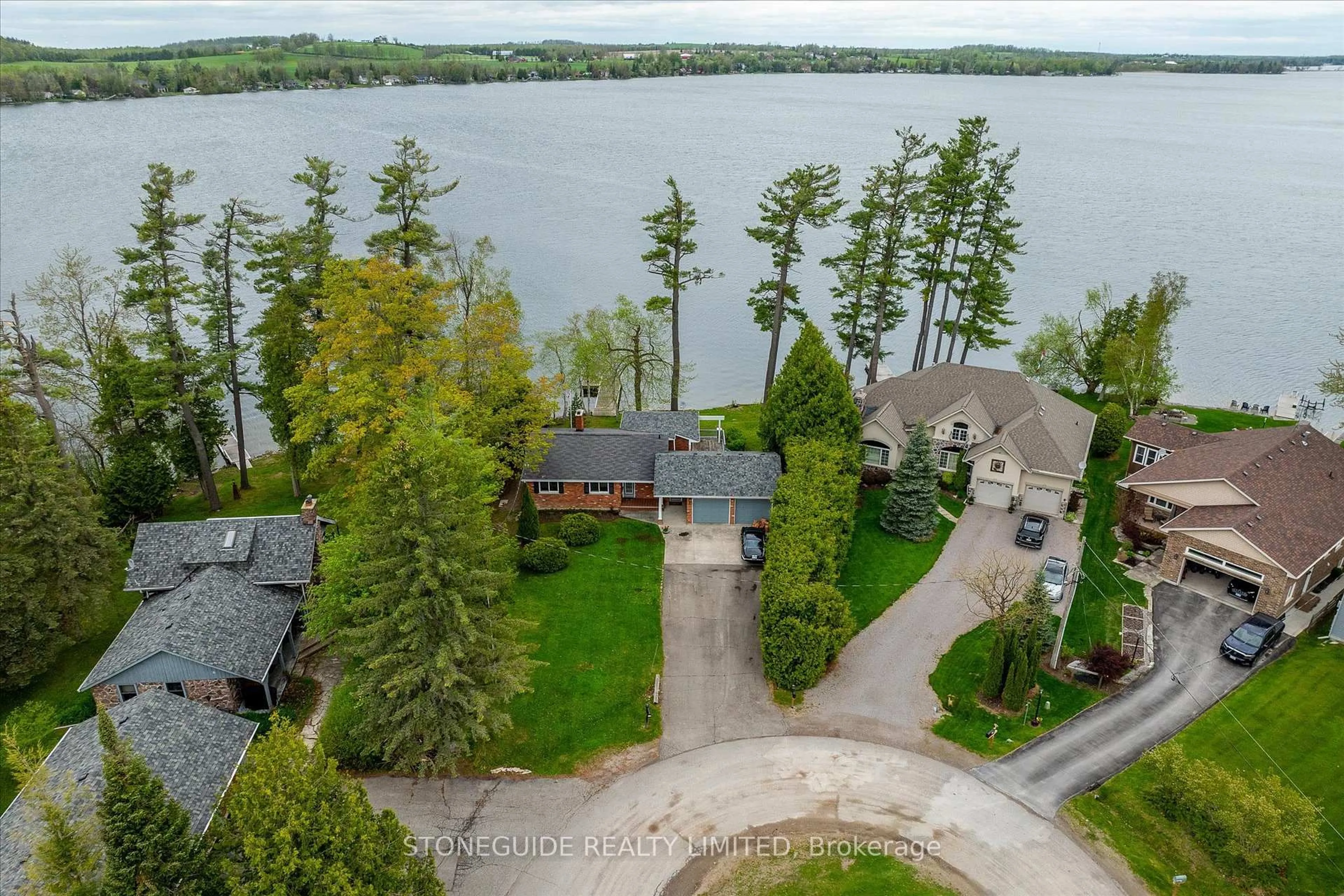 A pic from outside/outdoor area/front of a property/back of a property/a pic from drone, water/lake/river/ocean view for 917 Tindle Crt, Selwyn Ontario K9J 0C5