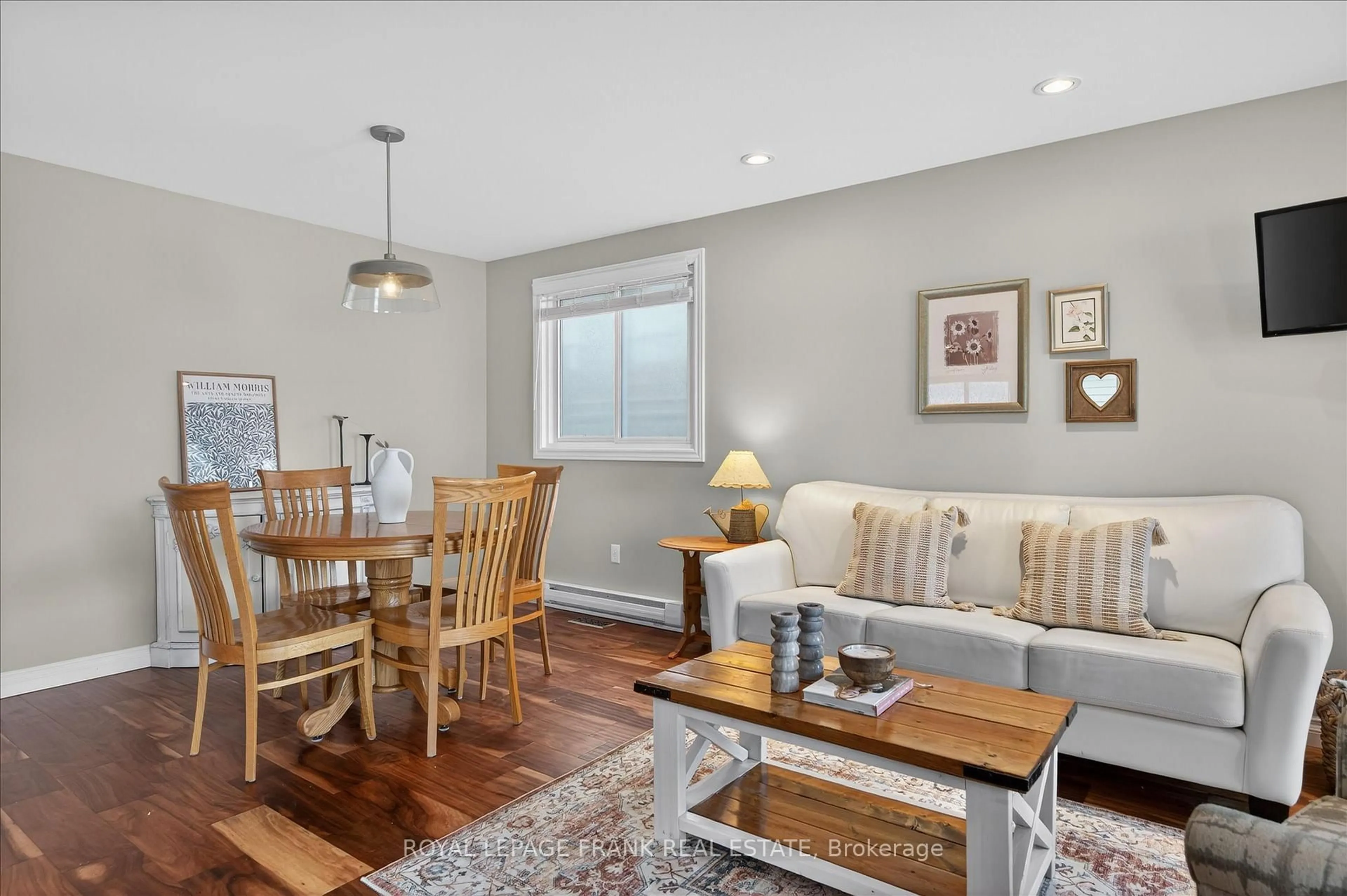 Living room with furniture, wood/laminate floor for 2139 Springwood Rd, Peterborough Ontario K9K 1N7
