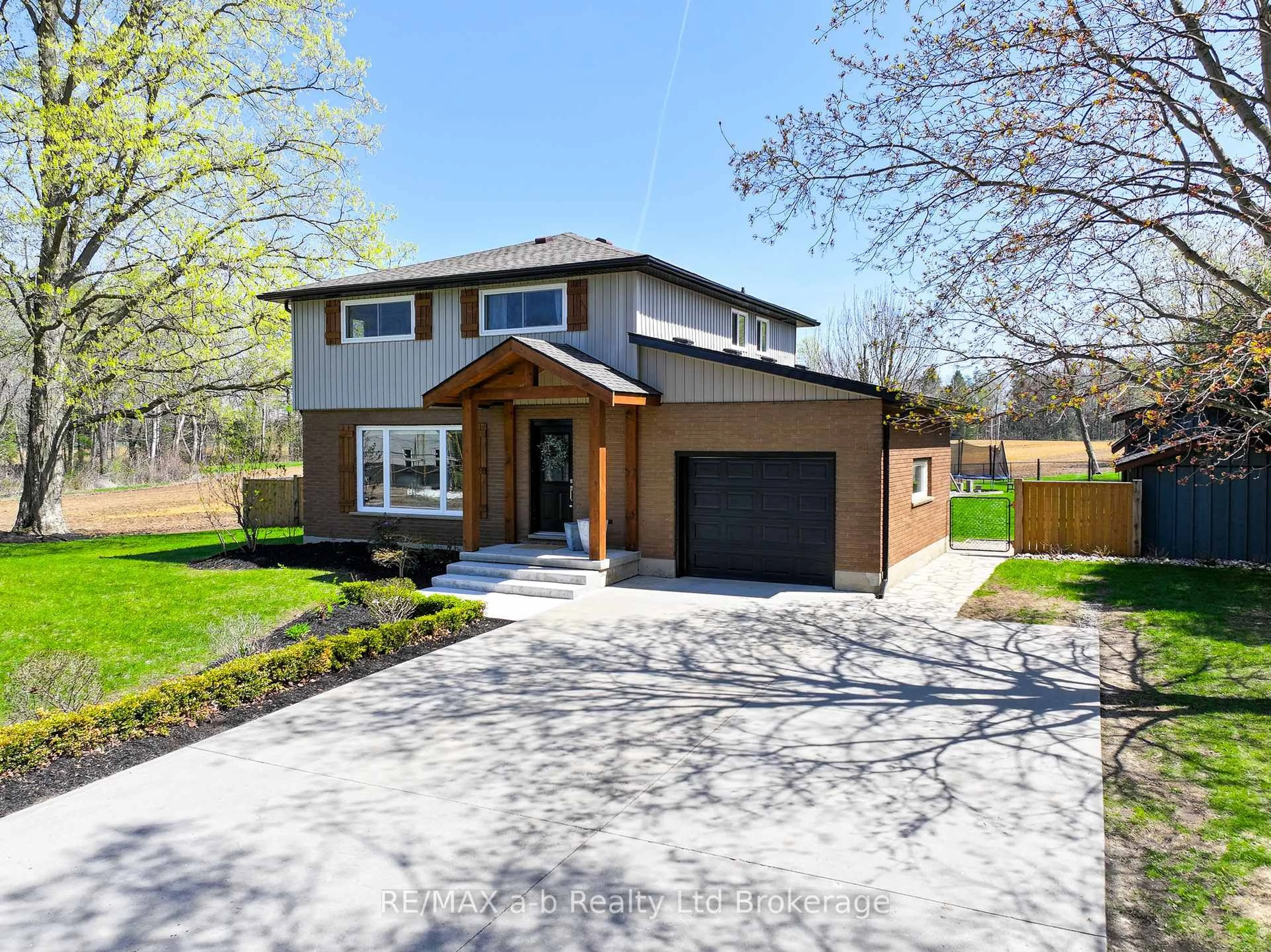 Home with brick exterior material, street for 144718 POTTERS Rd, Norwich Ontario N4G 4G7