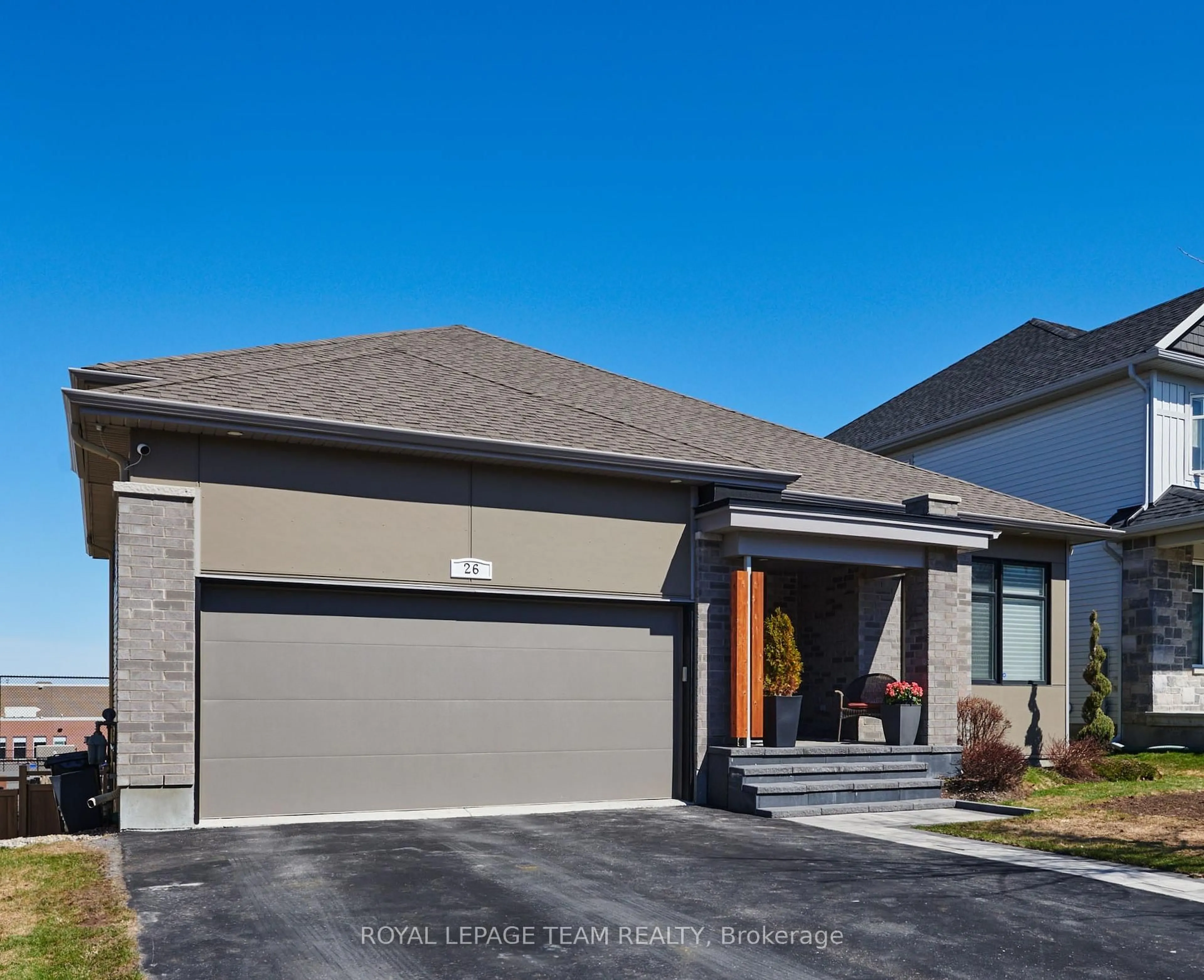 Home with brick exterior material, street for 26 Salamander Way, Ottawa Ontario K1X 0E9