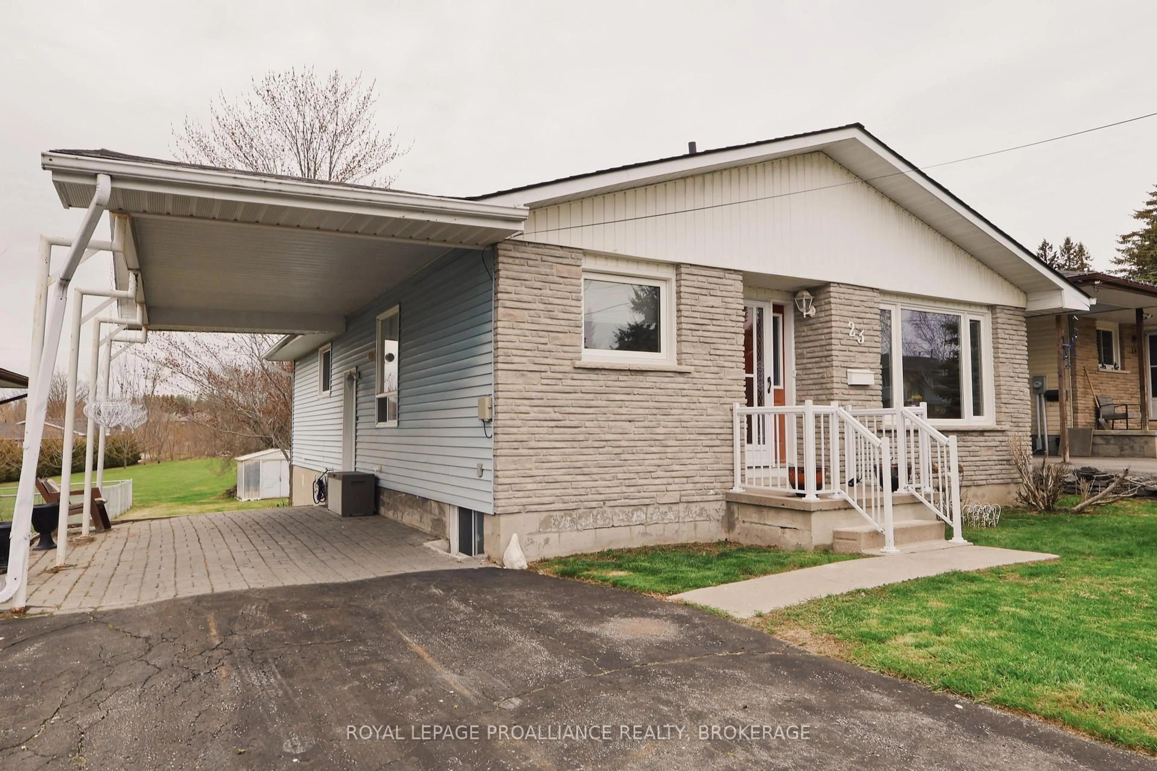 Home with vinyl exterior material, street for 23 Reid St, Greater Napanee Ontario K7R 3T9