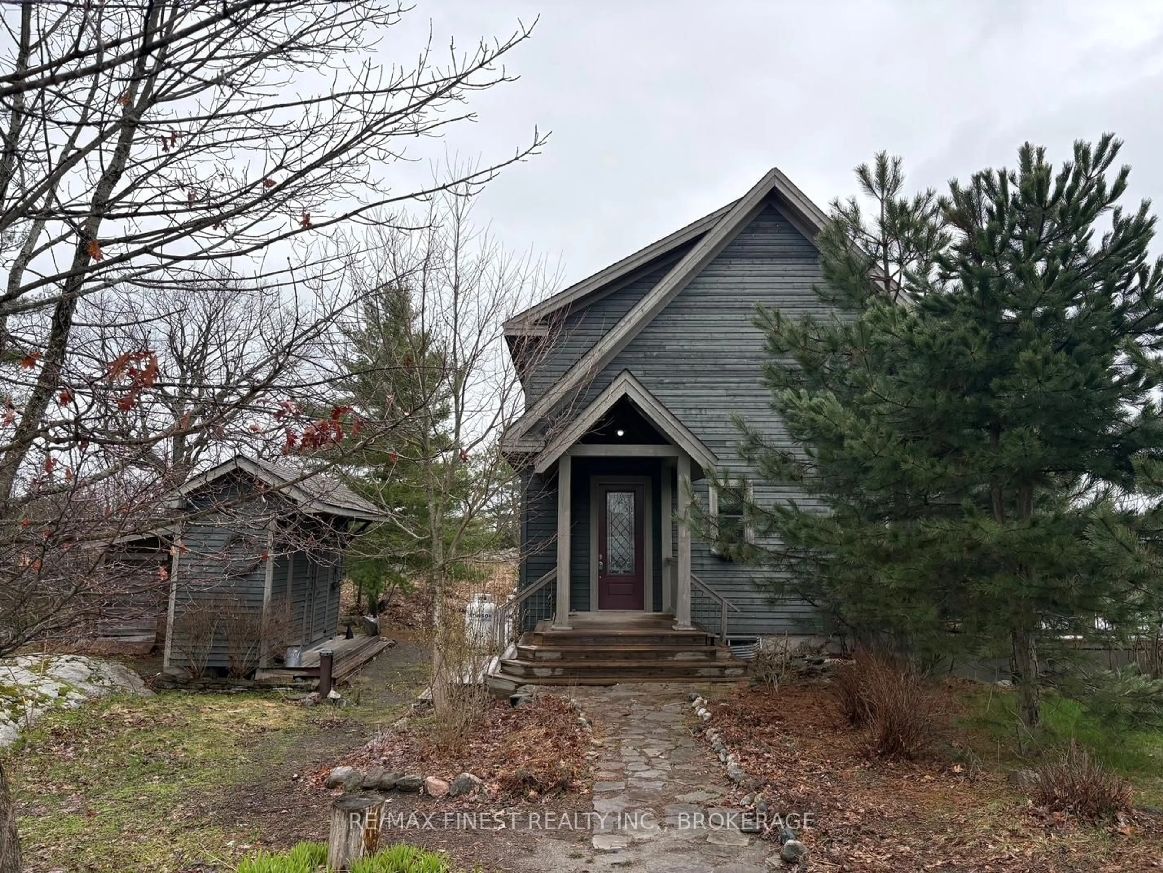 A pic from outside/outdoor area/front of a property/back of a property/a pic from drone, street for 1035 Sweetfern Lane, Inverary Ontario K0H 1X0