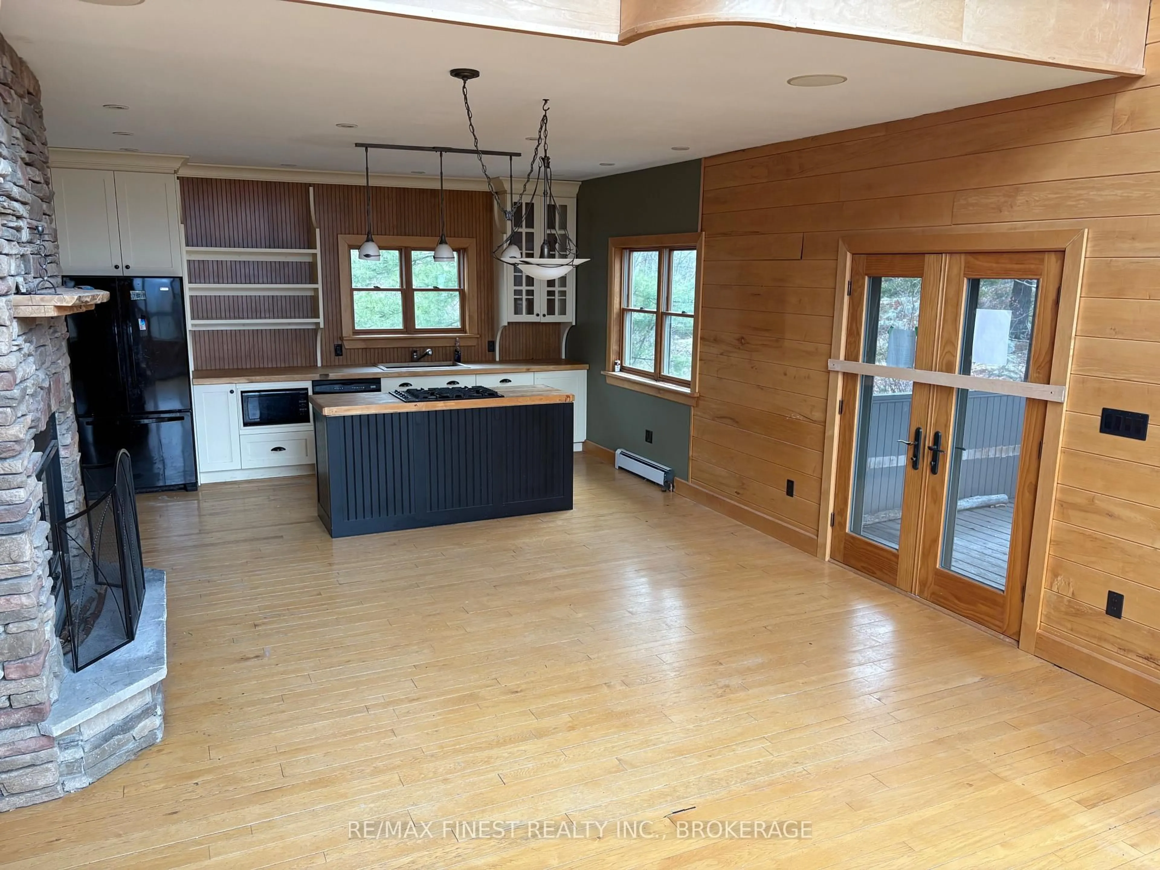 Open concept kitchen, wood/laminate floor for 1035 Sweetfern Lane, Inverary Ontario K0H 1X0