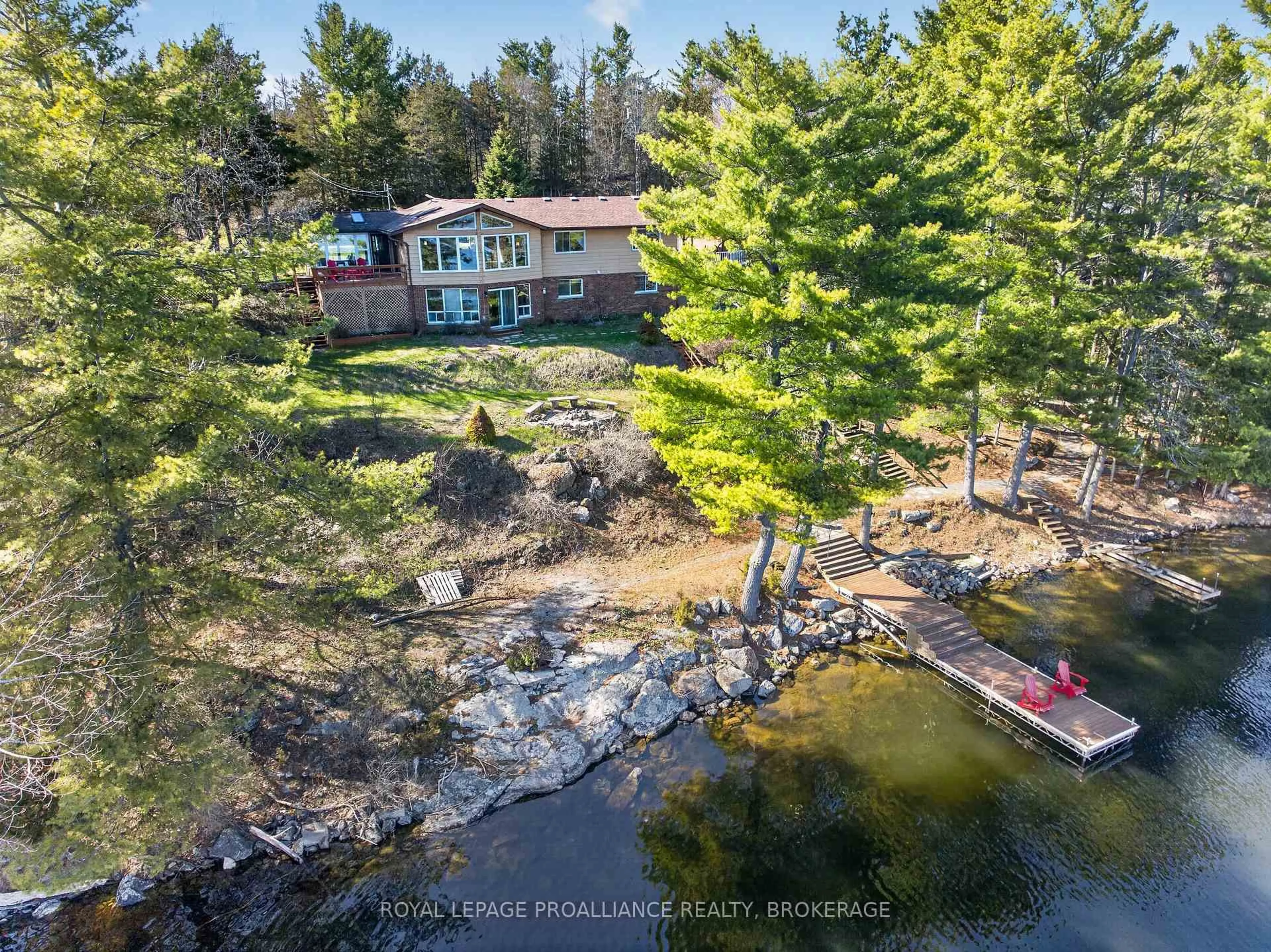 A pic from outside/outdoor area/front of a property/back of a property/a pic from drone, water/lake/river/ocean view for 3037 Hilltop Lane, Perth Road Ontario K0H 2L0
