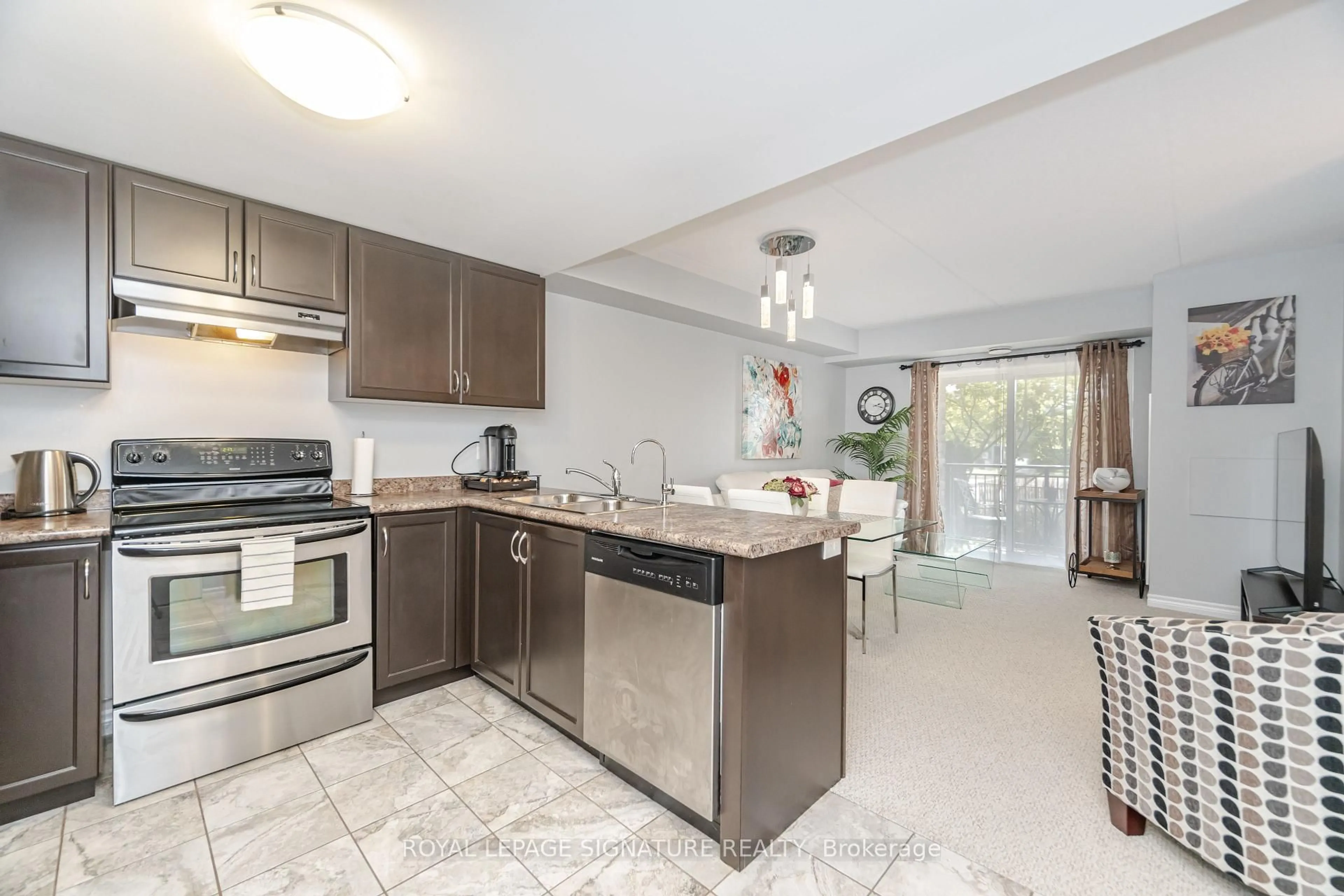 Open concept kitchen, ceramic/tile floor for 67 Kingsbury Sq #111, Guelph Ontario N1L 0L3