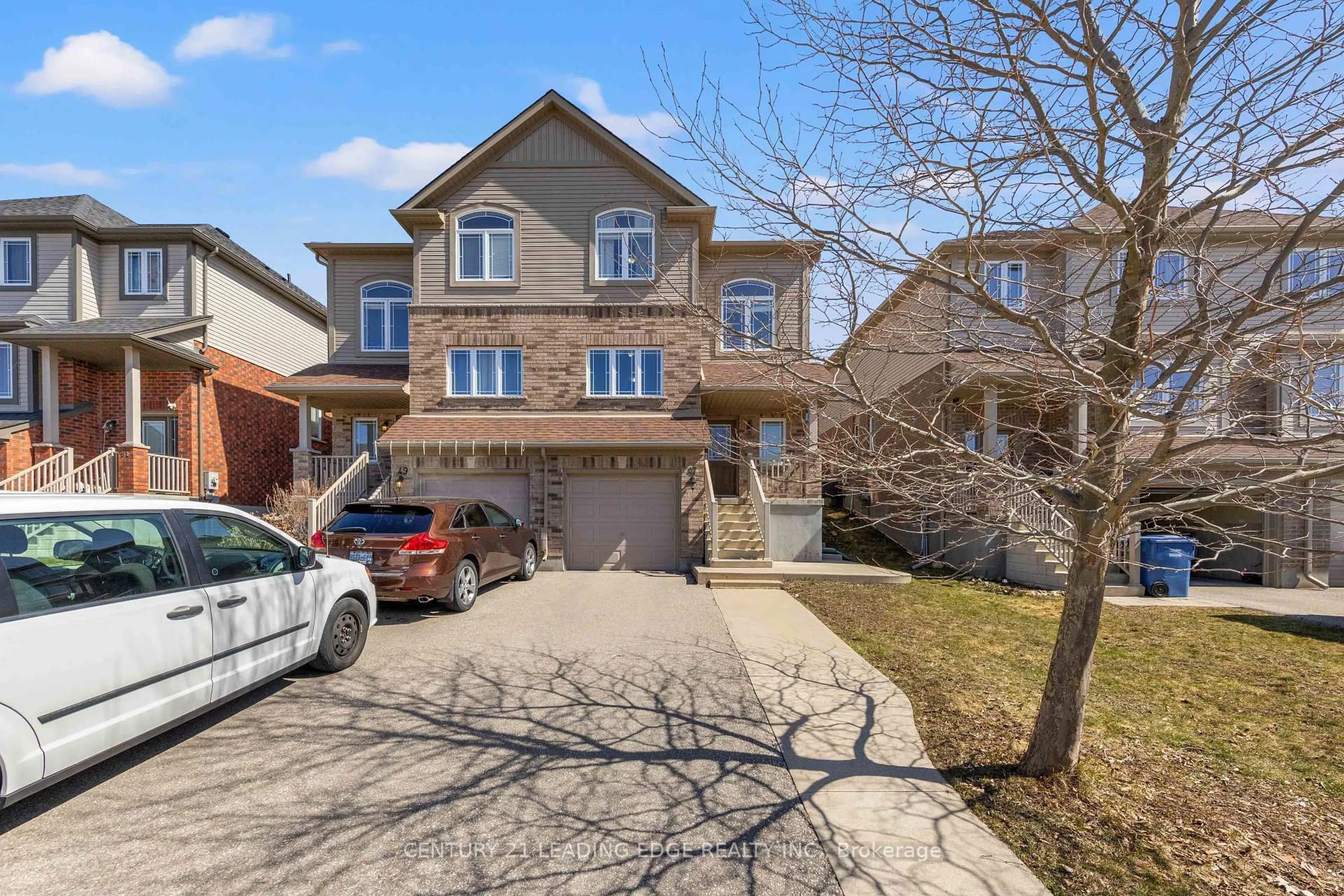 Home with brick exterior material, street for 47 OAKES Cres, Guelph Ontario N1E 0J6