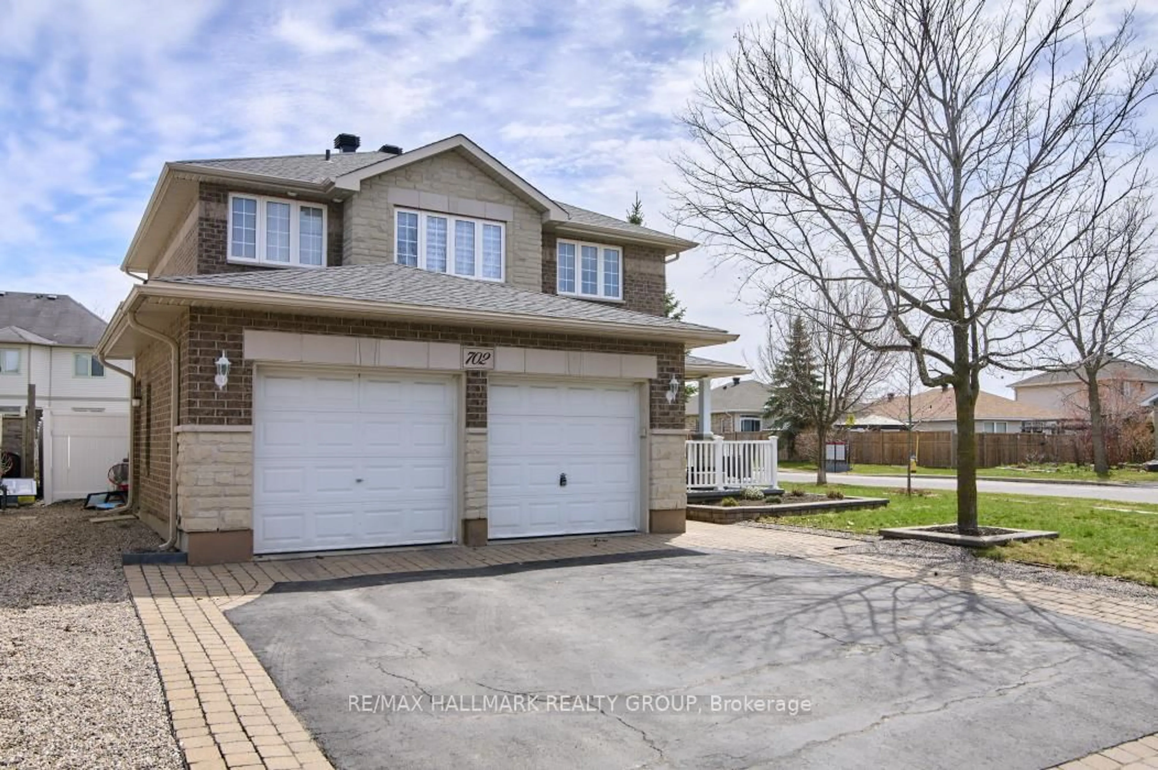 Home with brick exterior material, street for 702 Mud Creek Cres, Ottawa Ontario K1V 1W3
