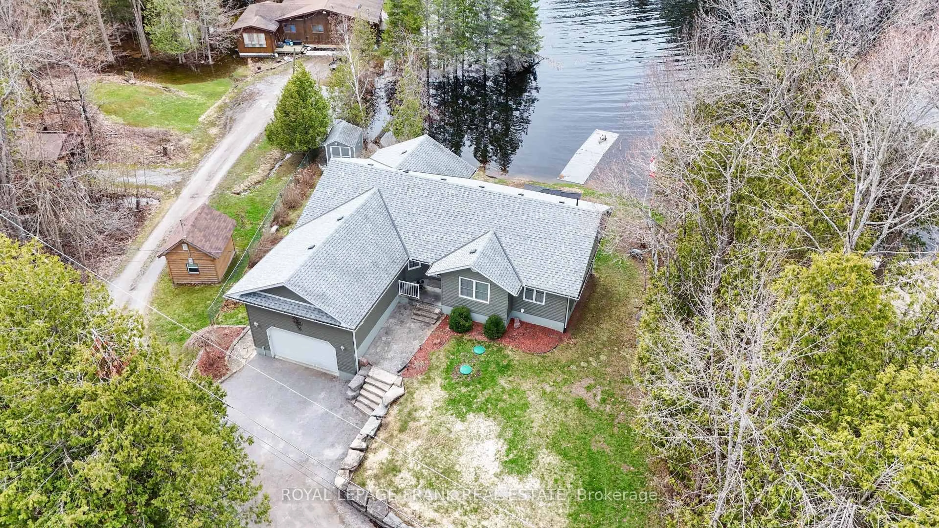 A pic from outside/outdoor area/front of a property/back of a property/a pic from drone, water/lake/river/ocean view for 34 Fire Route 96 Rte, Trent Lakes Ontario K0M 1A0