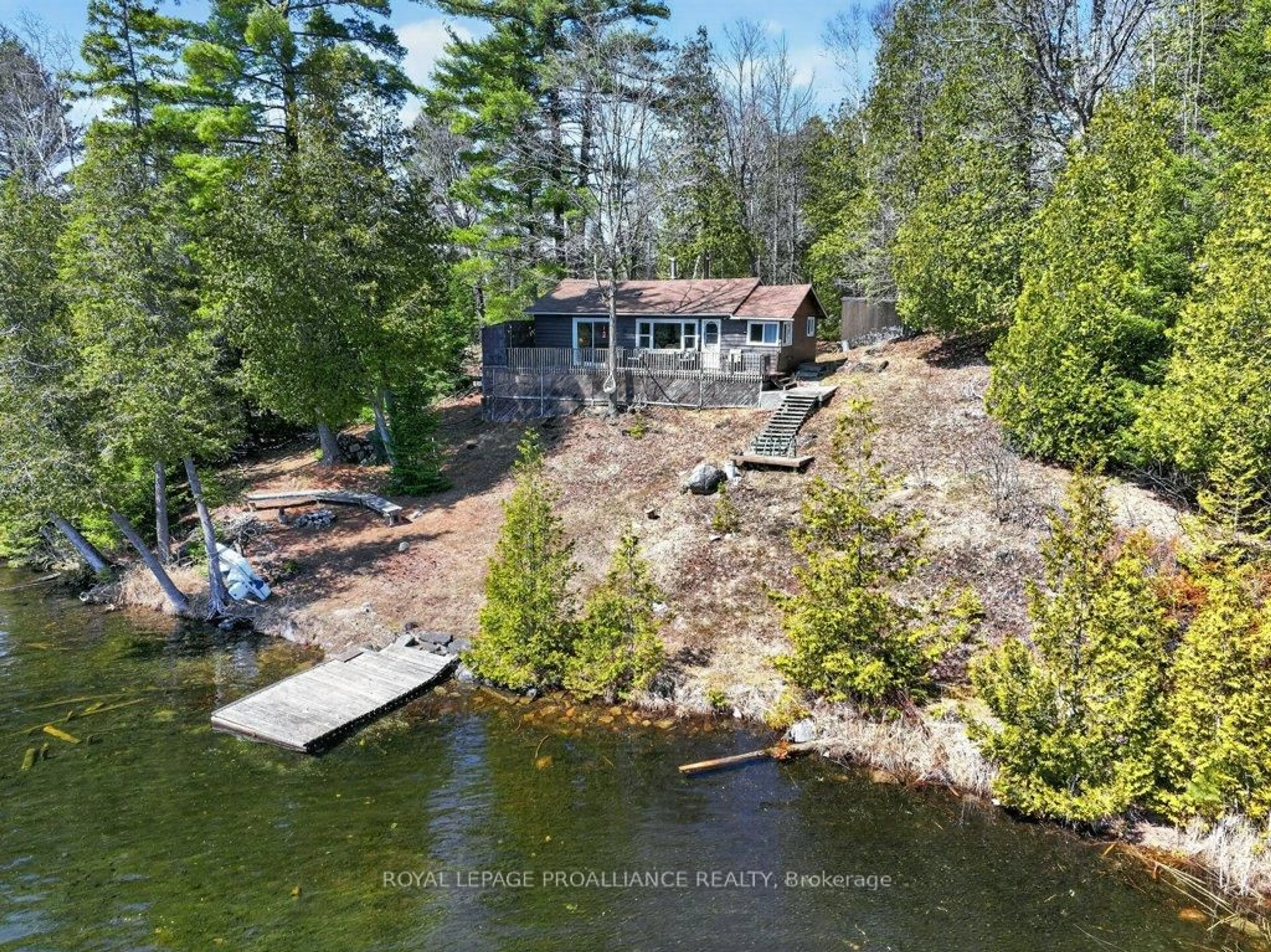 A pic from outside/outdoor area/front of a property/back of a property/a pic from drone, water/lake/river/ocean view for 1138A Watkins Lane, Ardoch Ontario K0H 1C0