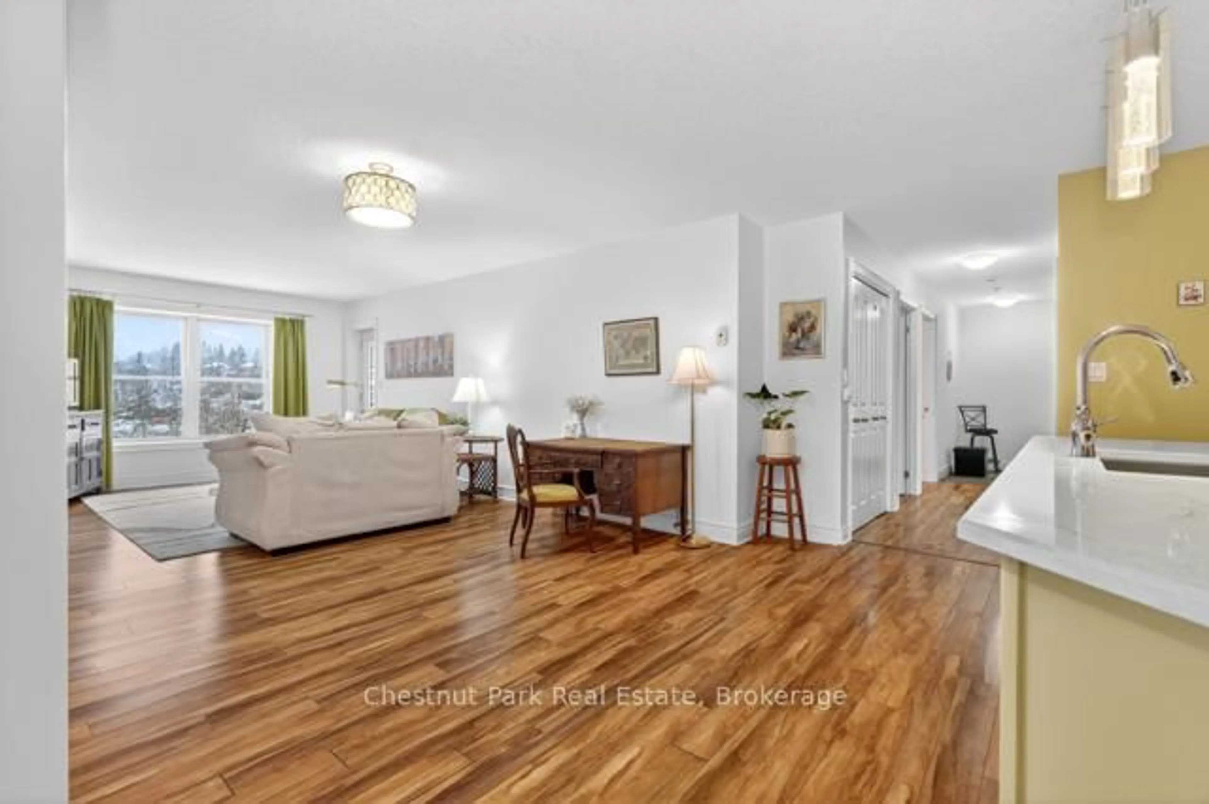 Living room with furniture, wood/laminate floor for 10A KIMBERLEY Ave #GL-1, Bracebridge Ontario P1L 0A4