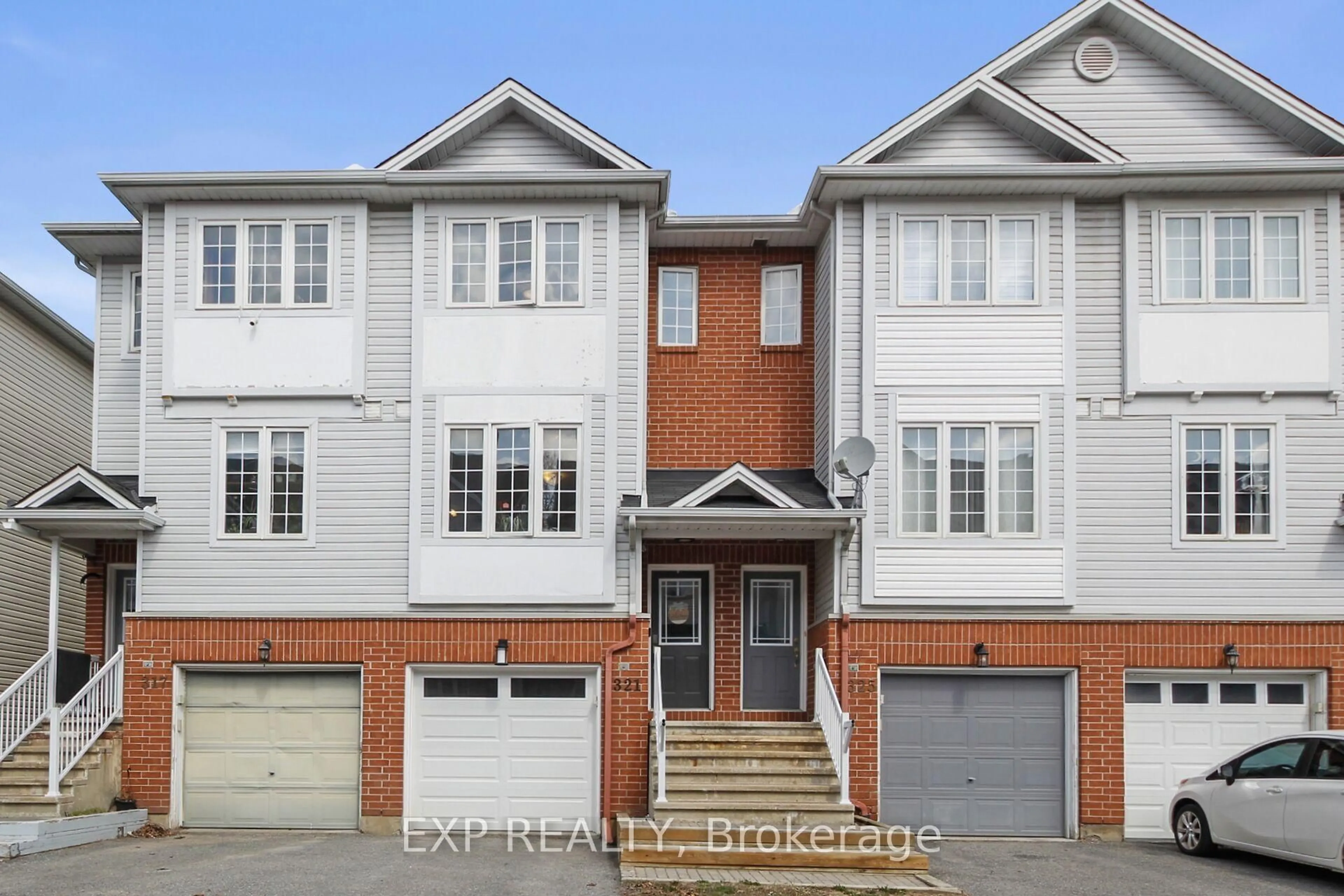 Home with brick exterior material, street for 321 Wiffen Private, Ottawa Ontario K2H 1G3