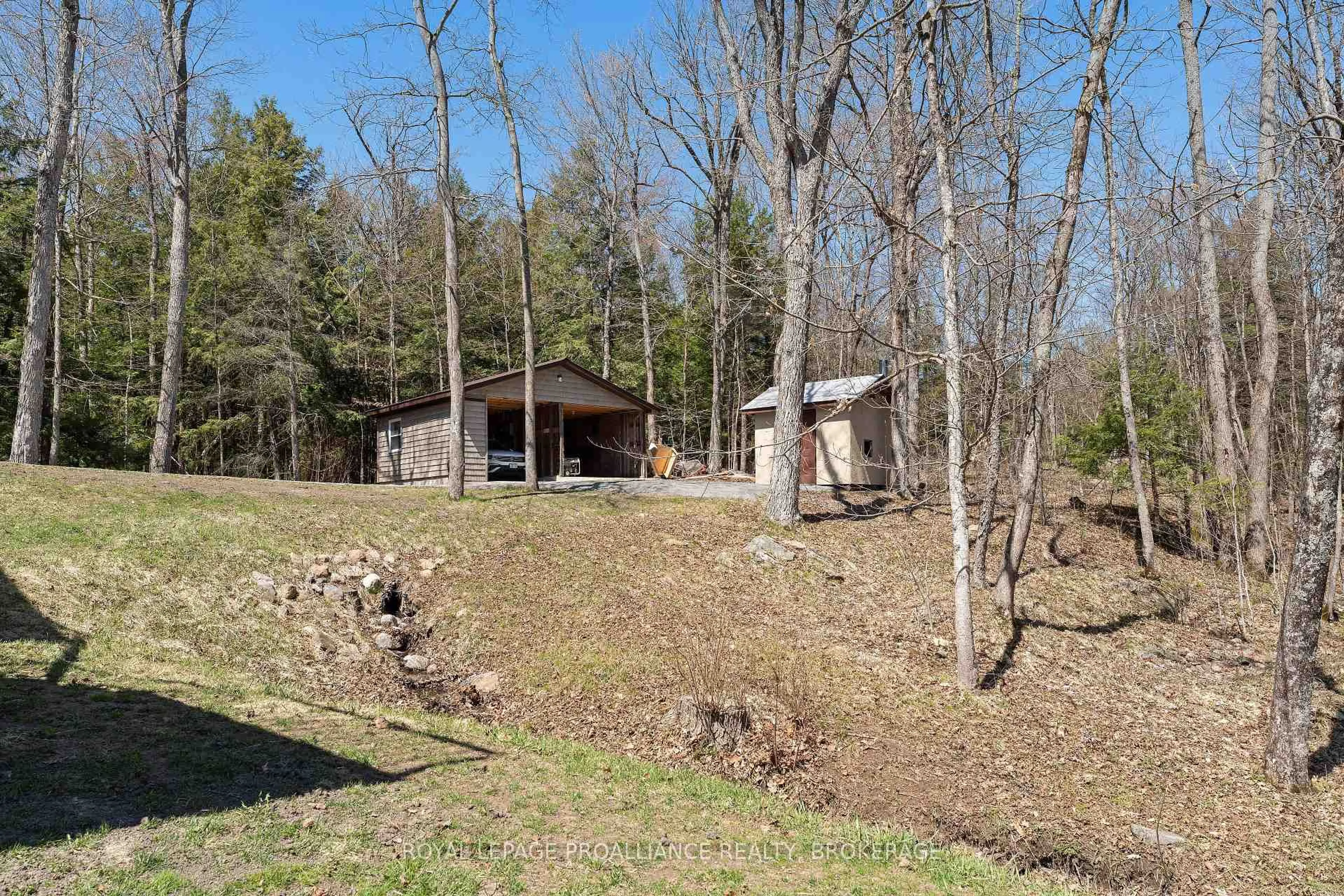 A pic from outside/outdoor area/front of a property/back of a property/a pic from drone, forest/trees view for 1210 Richard Brannigan Tr, Godfrey Ontario K0H 1T0