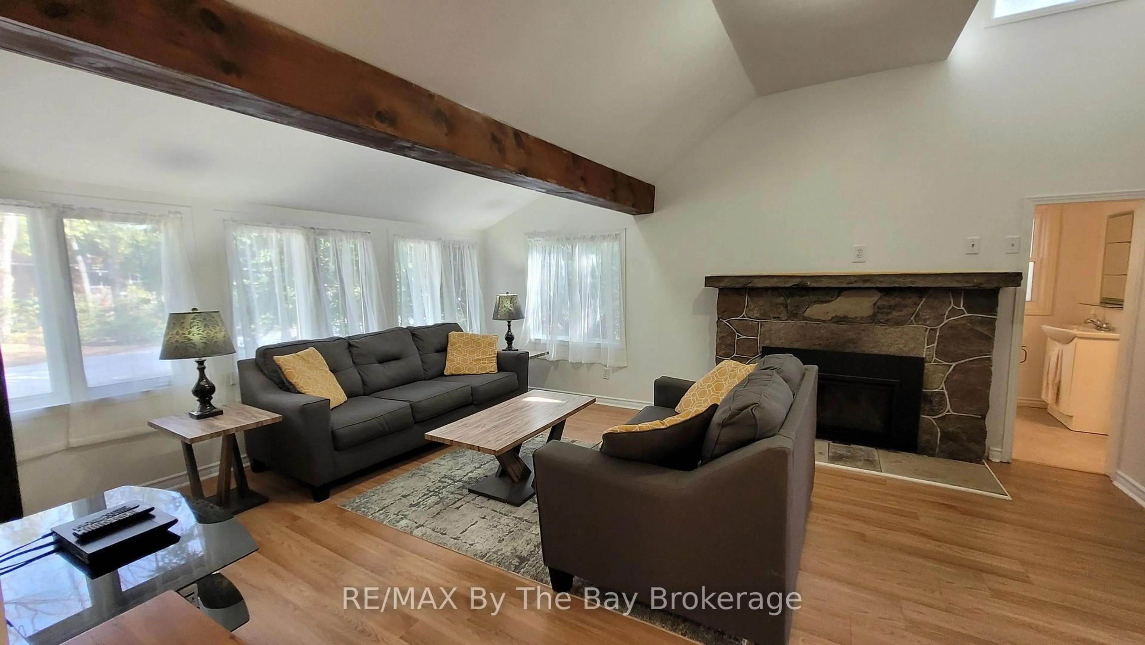 Living room with furniture, wood/laminate floor for 1120 King Edward Ave, South Bruce Peninsula Ontario N0H 2G0