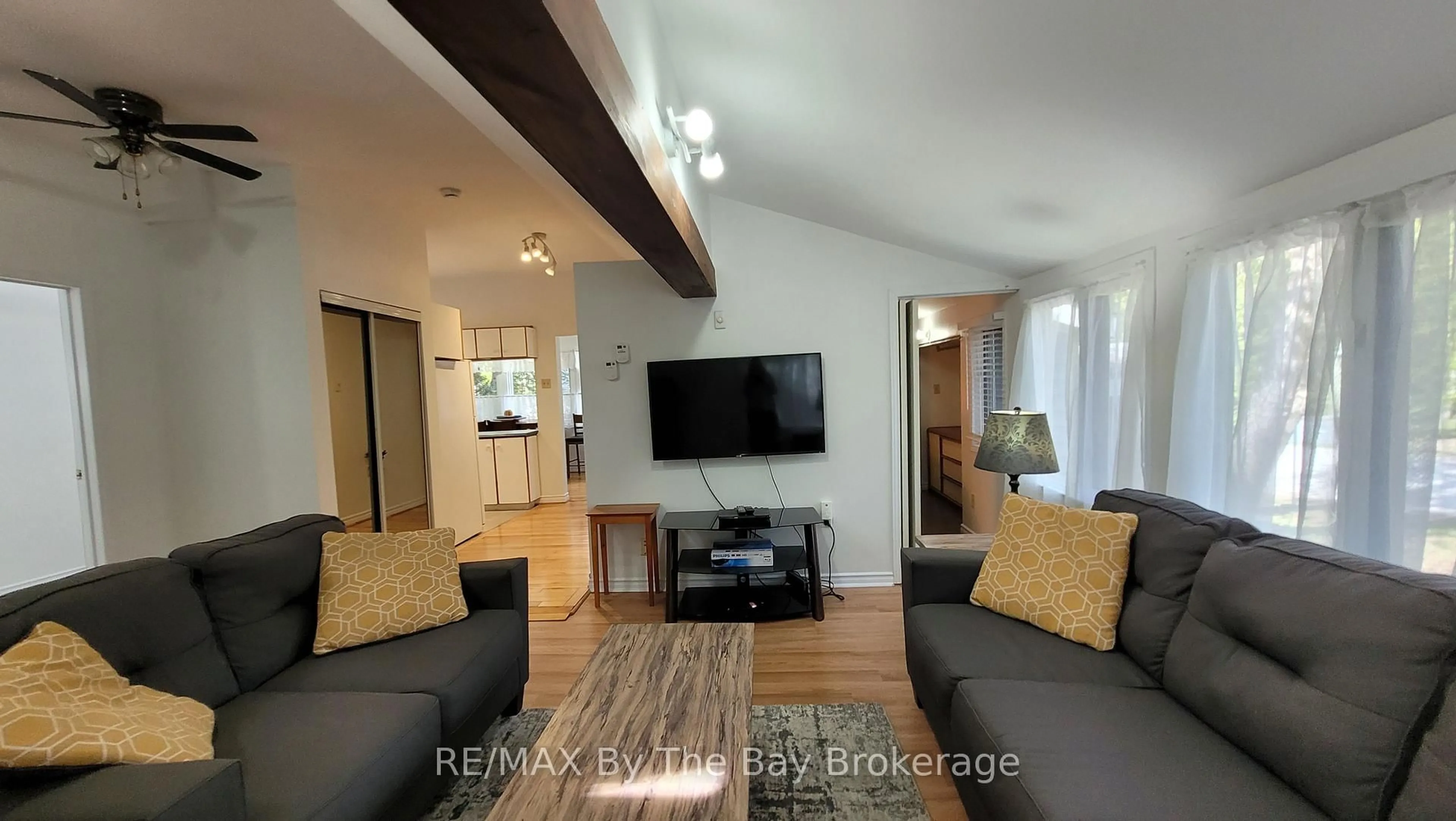 Living room with furniture, wood/laminate floor for 1120 King Edward Ave, South Bruce Peninsula Ontario N0H 2G0