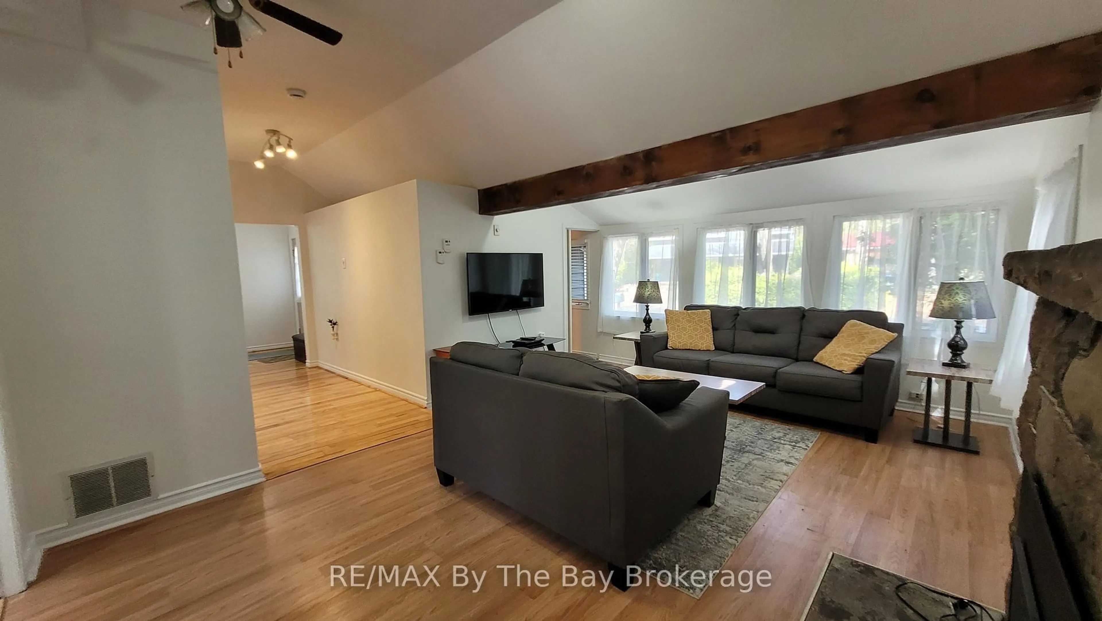Living room with furniture, wood/laminate floor for 1120 King Edward Ave, South Bruce Peninsula Ontario N0H 2G0