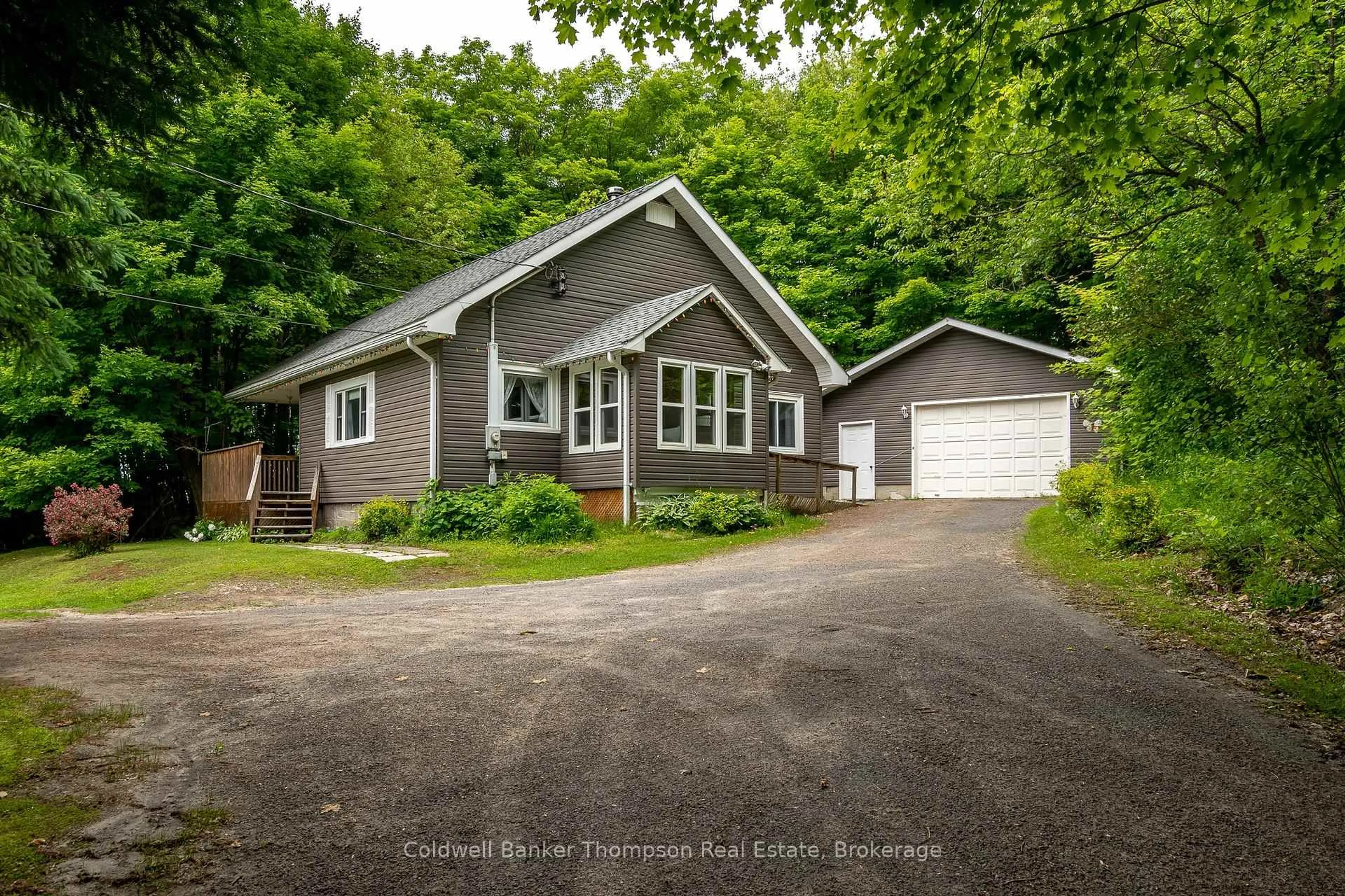 A pic from outside/outdoor area/front of a property/back of a property/a pic from drone, street for 66 Hanes Rd, Huntsville Ontario P1H 1M3