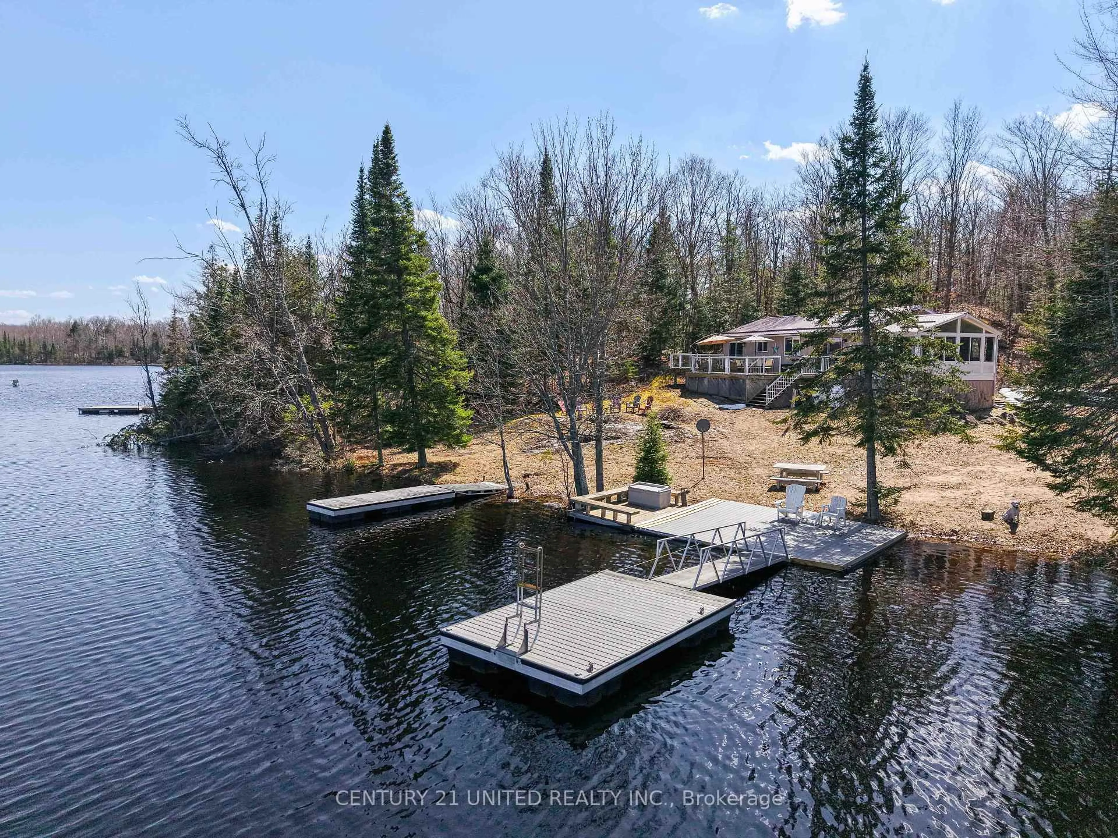 A pic from outside/outdoor area/front of a property/back of a property/a pic from drone, water/lake/river/ocean view for 1047 Redwood Lane, Highlands East Ontario K0L 1C0