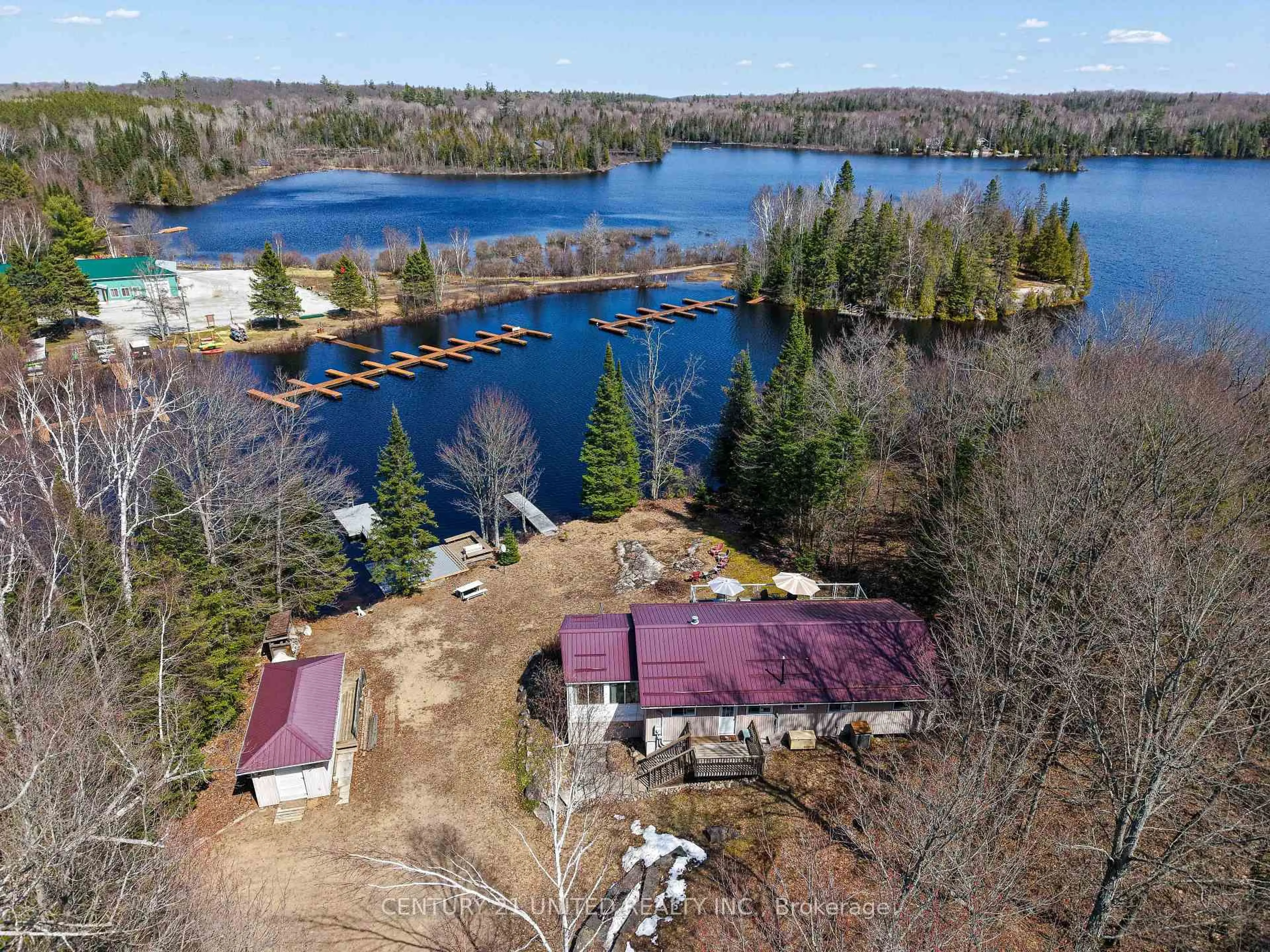 A pic from outside/outdoor area/front of a property/back of a property/a pic from drone, water/lake/river/ocean view for 1047 Redwood Lane, Highlands East Ontario K0L 1C0