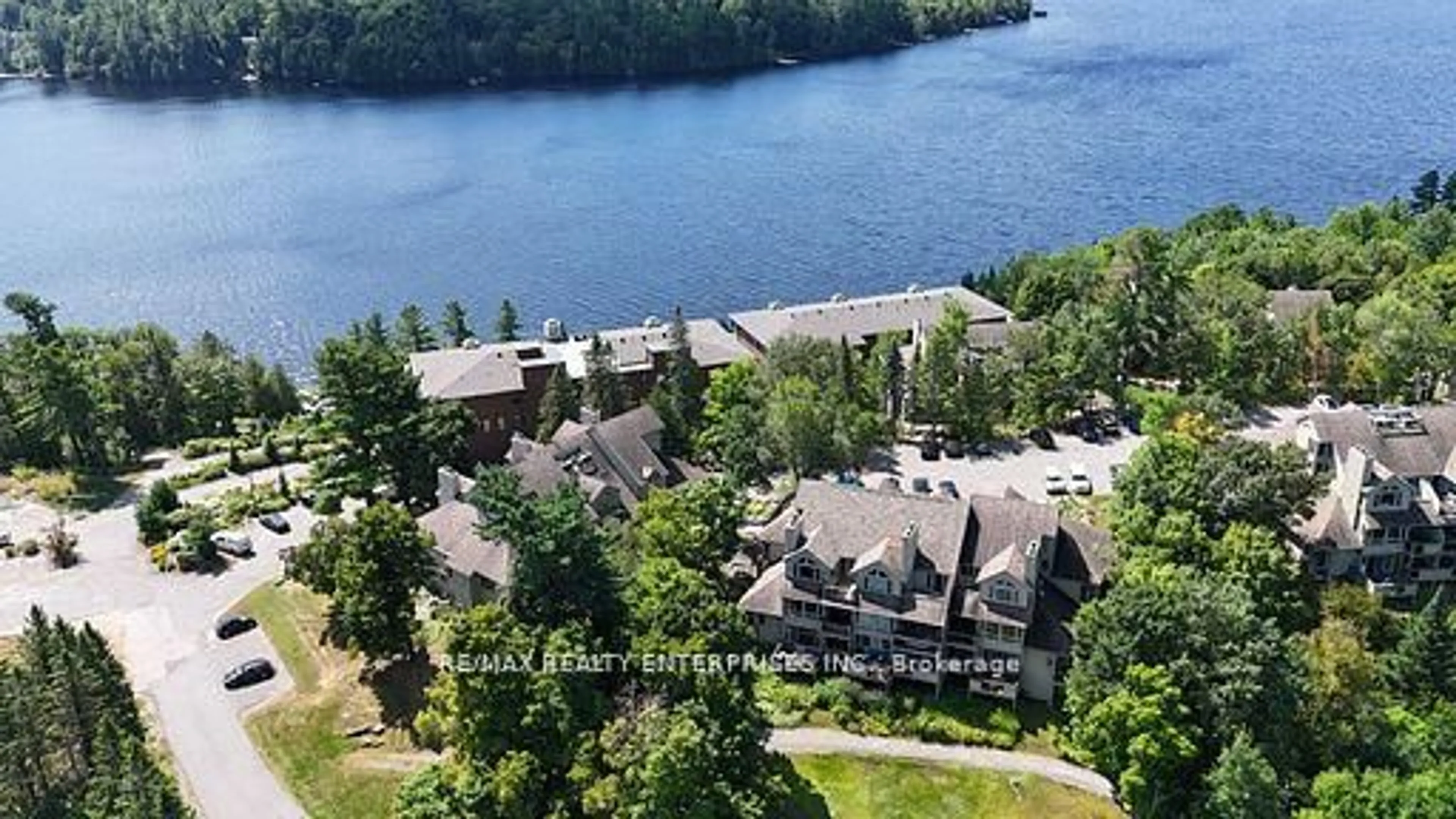 A pic from outside/outdoor area/front of a property/back of a property/a pic from drone, water/lake/river/ocean view for 811 Grandview Hilltop Dr #8, Huntsville Ontario P1H 2J5