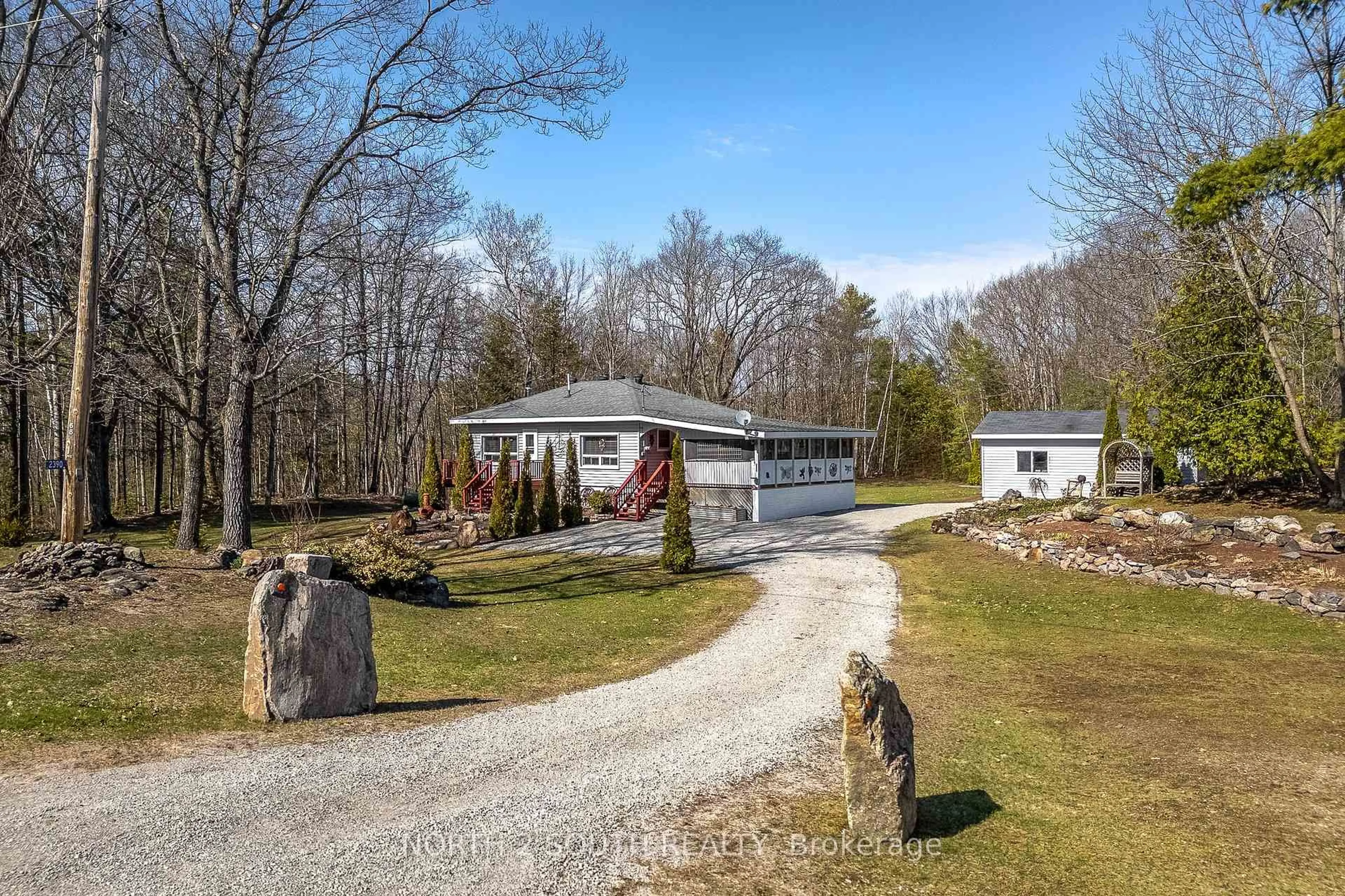 A pic from outside/outdoor area/front of a property/back of a property/a pic from drone, water/lake/river/ocean view for 2390 Honey Harbour Rd, Georgian Bay Ontario P0E 1E0