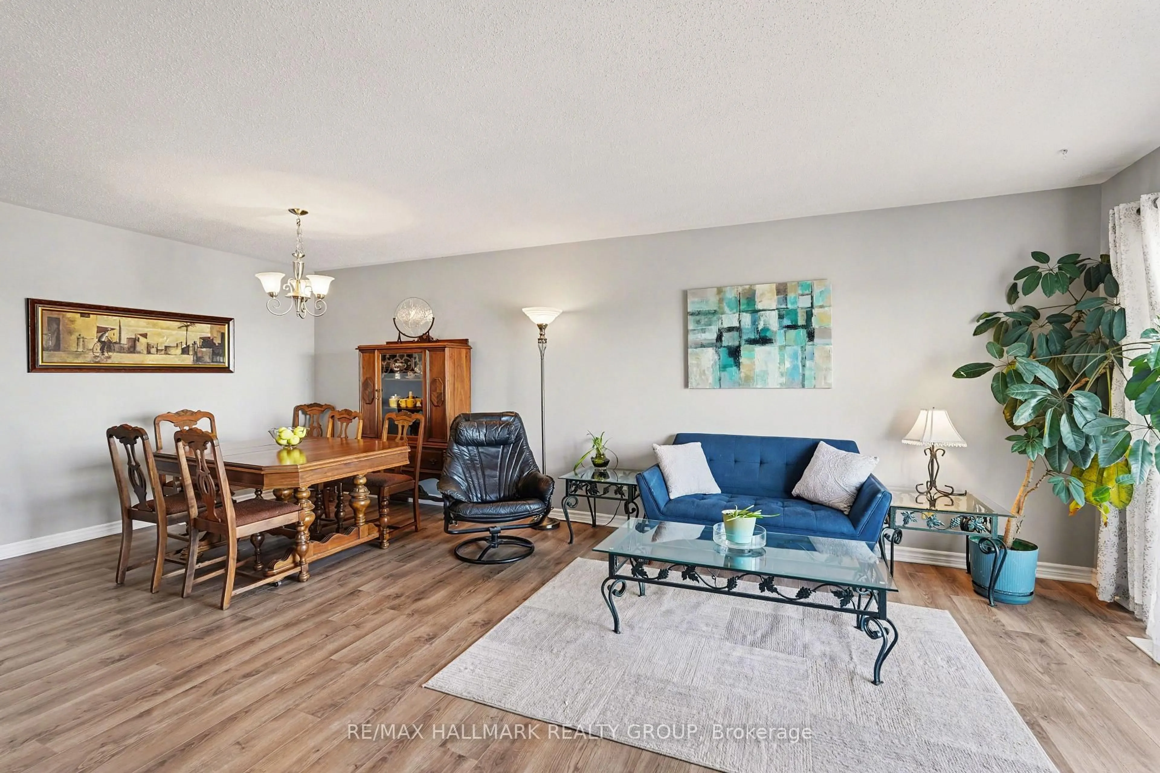 Living room with furniture, wood/laminate floor for 3275 St Joseph Blvd #205, Ottawa Ontario K1E 3Y3