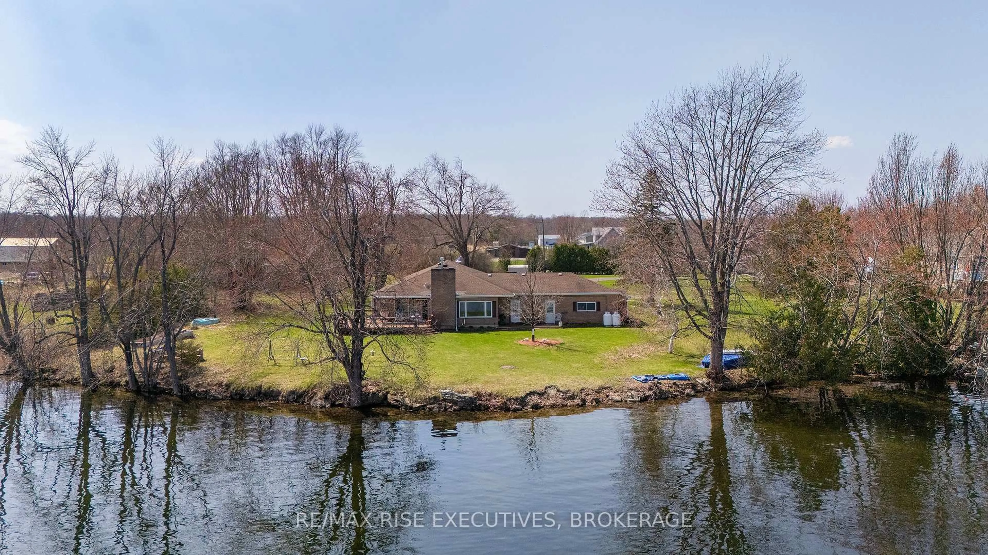 A pic from outside/outdoor area/front of a property/back of a property/a pic from drone, water/lake/river/ocean view for 5054 Lower Round Lake Rd, Battersea Ontario K0H 1H0