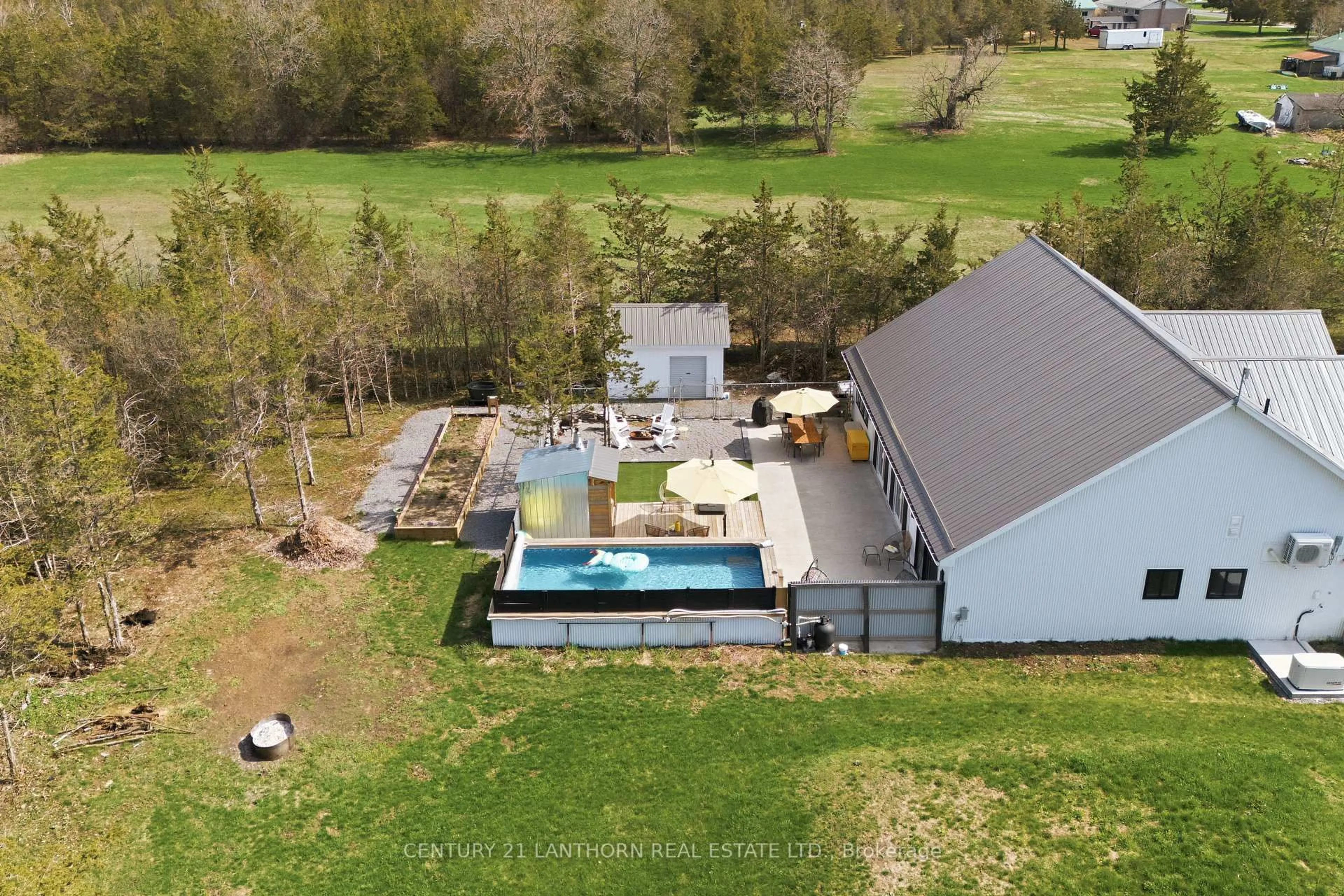 A pic from outside/outdoor area/front of a property/back of a property/a pic from drone, water/lake/river/ocean view for 2654 County Road 5, Prince Edward County Ontario K0K 1W0