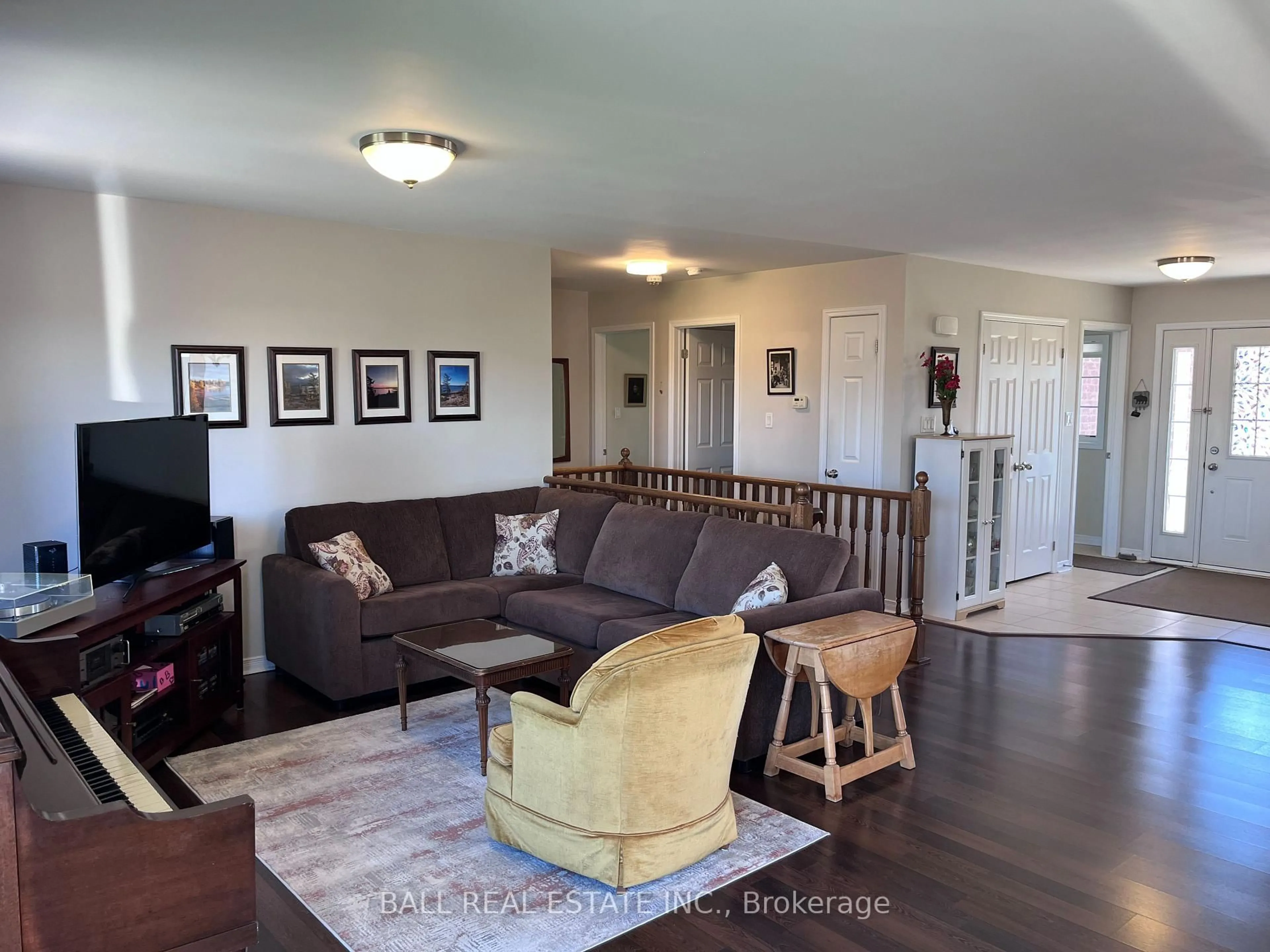 Living room with furniture, wood/laminate floor for 6 Maple Ave, Asphodel-Norwood Ontario K0L 2V0