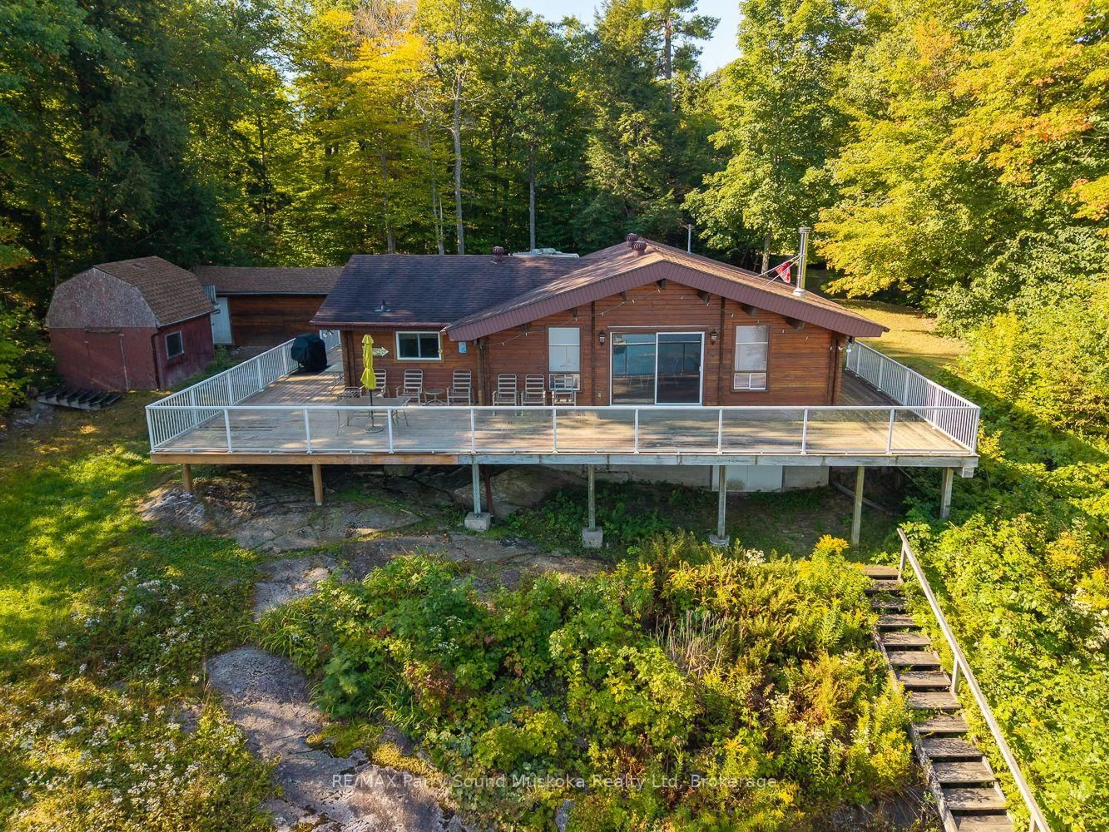 A pic from outside/outdoor area/front of a property/back of a property/a pic from drone, water/lake/river/ocean view for 30 Old Sids Rd, Seguin Ontario P2A 2W8