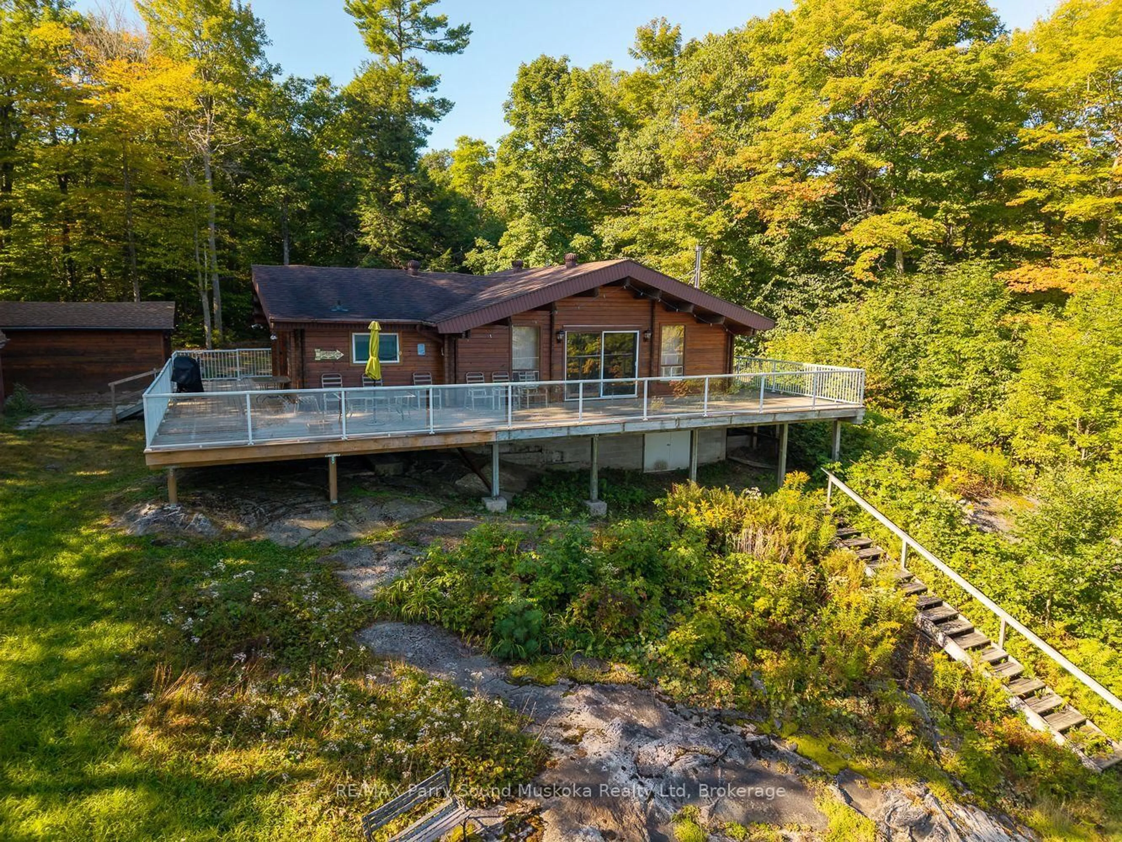 A pic from outside/outdoor area/front of a property/back of a property/a pic from drone, water/lake/river/ocean view for 30 Old Sids Rd, Seguin Ontario P2A 2W8
