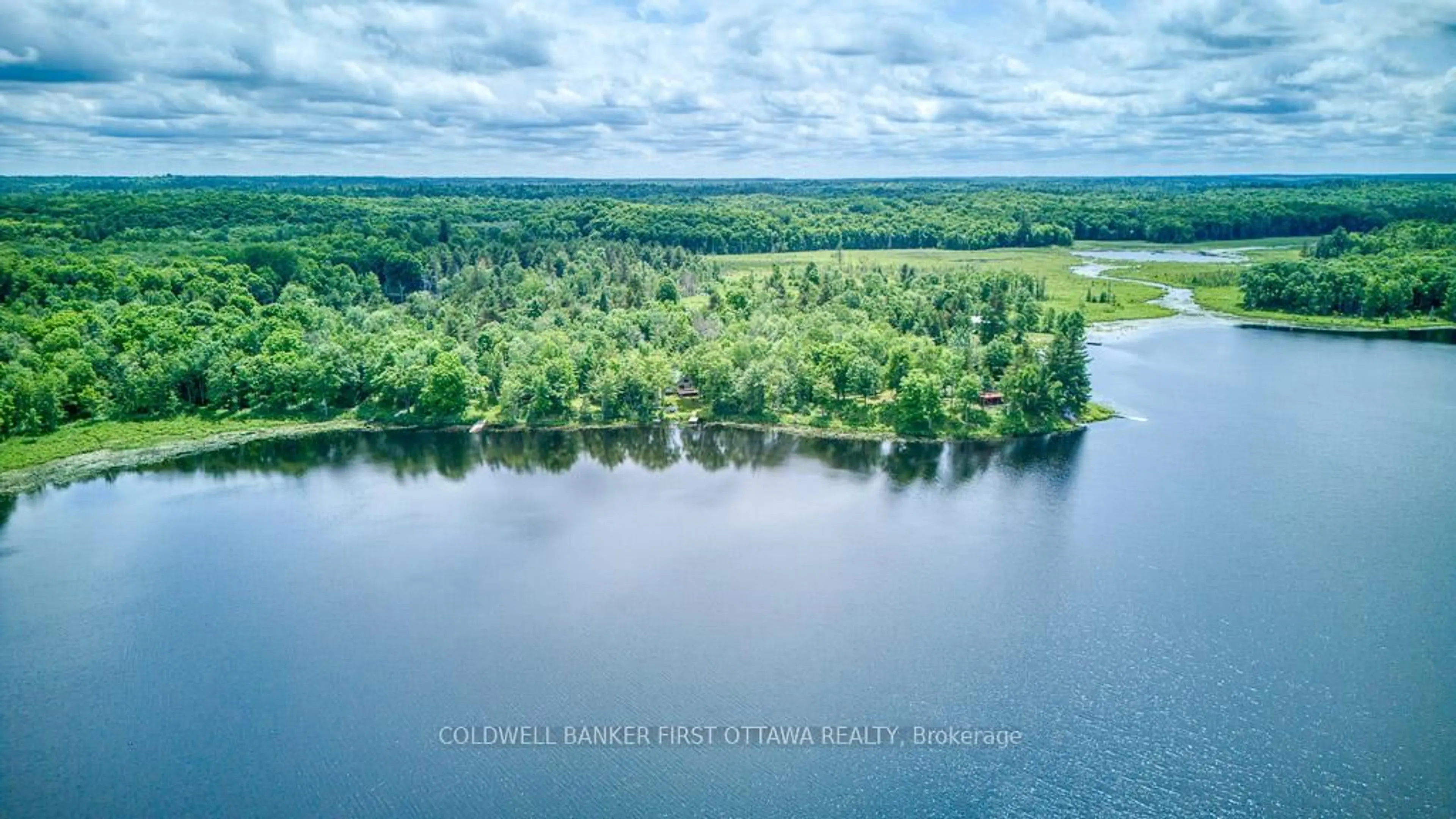 A pic from outside/outdoor area/front of a property/back of a property/a pic from drone, water/lake/river/ocean view for 1305 Thunder Lane, Arden Ontario K0H 1B0