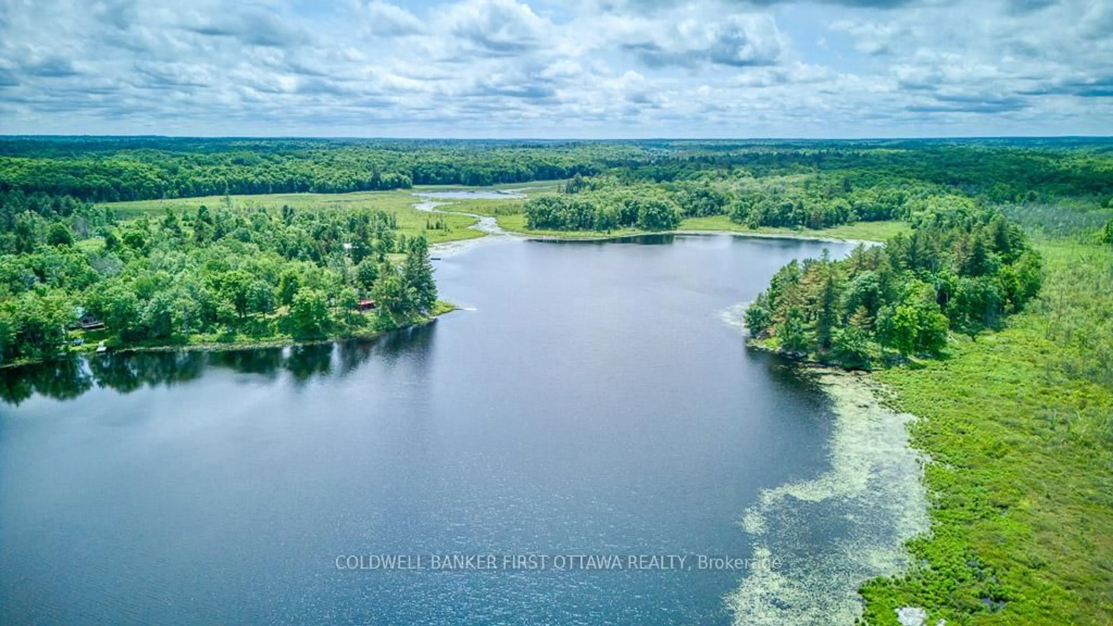 A pic from outside/outdoor area/front of a property/back of a property/a pic from drone, water/lake/river/ocean view for 1305 Thunder Lane, Arden Ontario K0H 1B0