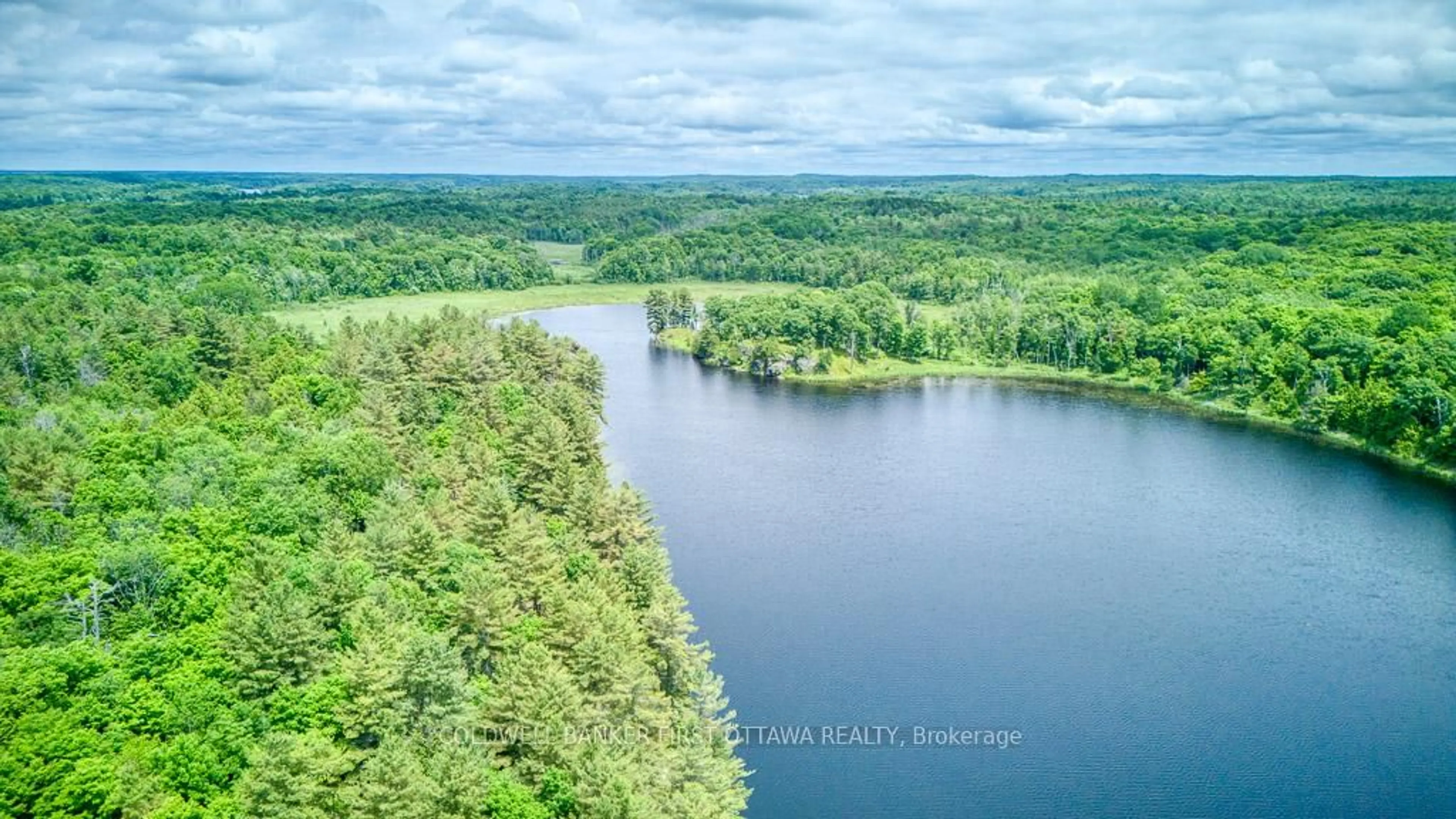 A pic from outside/outdoor area/front of a property/back of a property/a pic from drone, water/lake/river/ocean view for 1305 Thunder Lane, Arden Ontario K0H 1B0