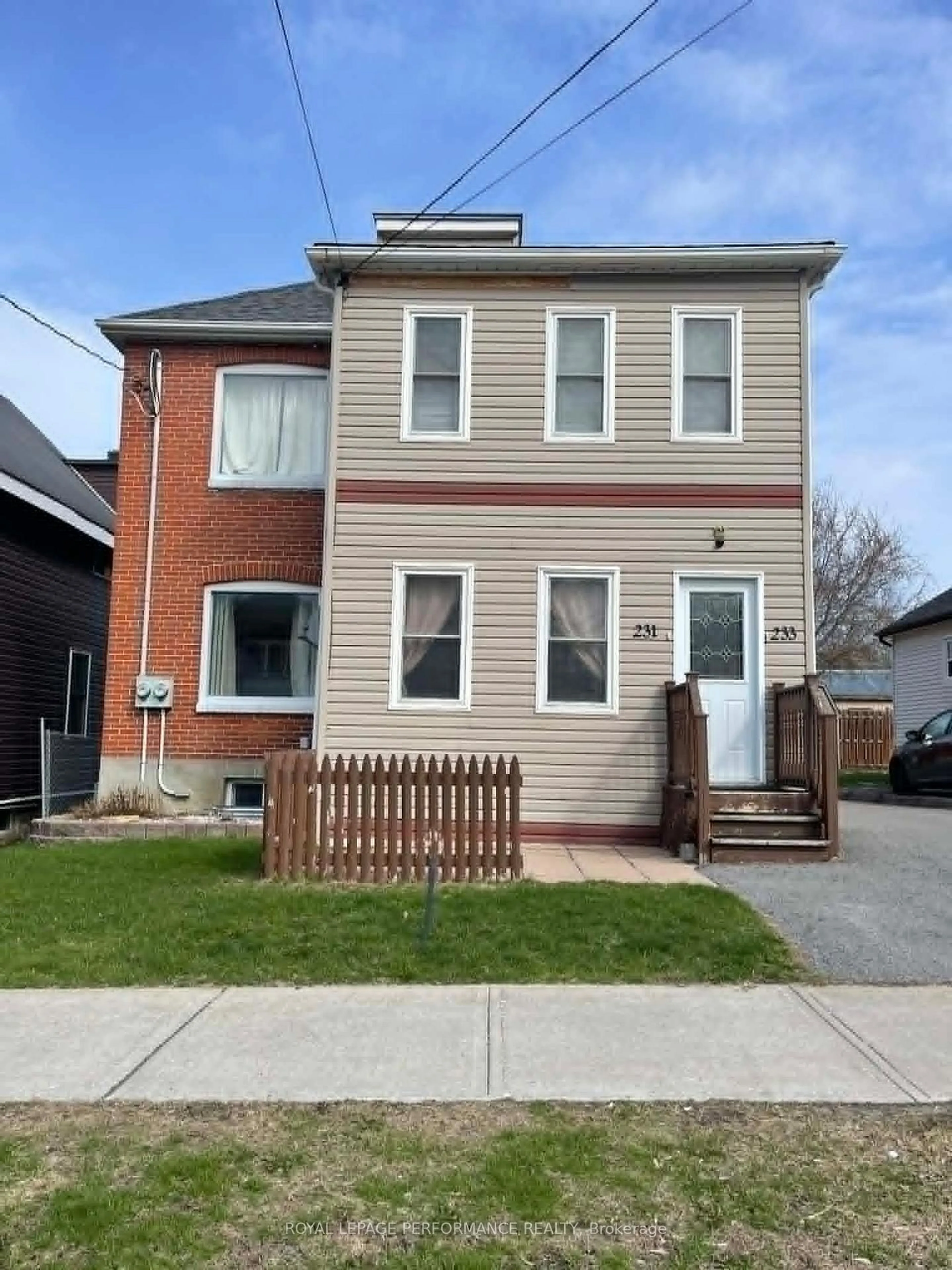 Home with brick exterior material, street for 231-233 Fifth St, Cornwall Ontario K6H 2L7