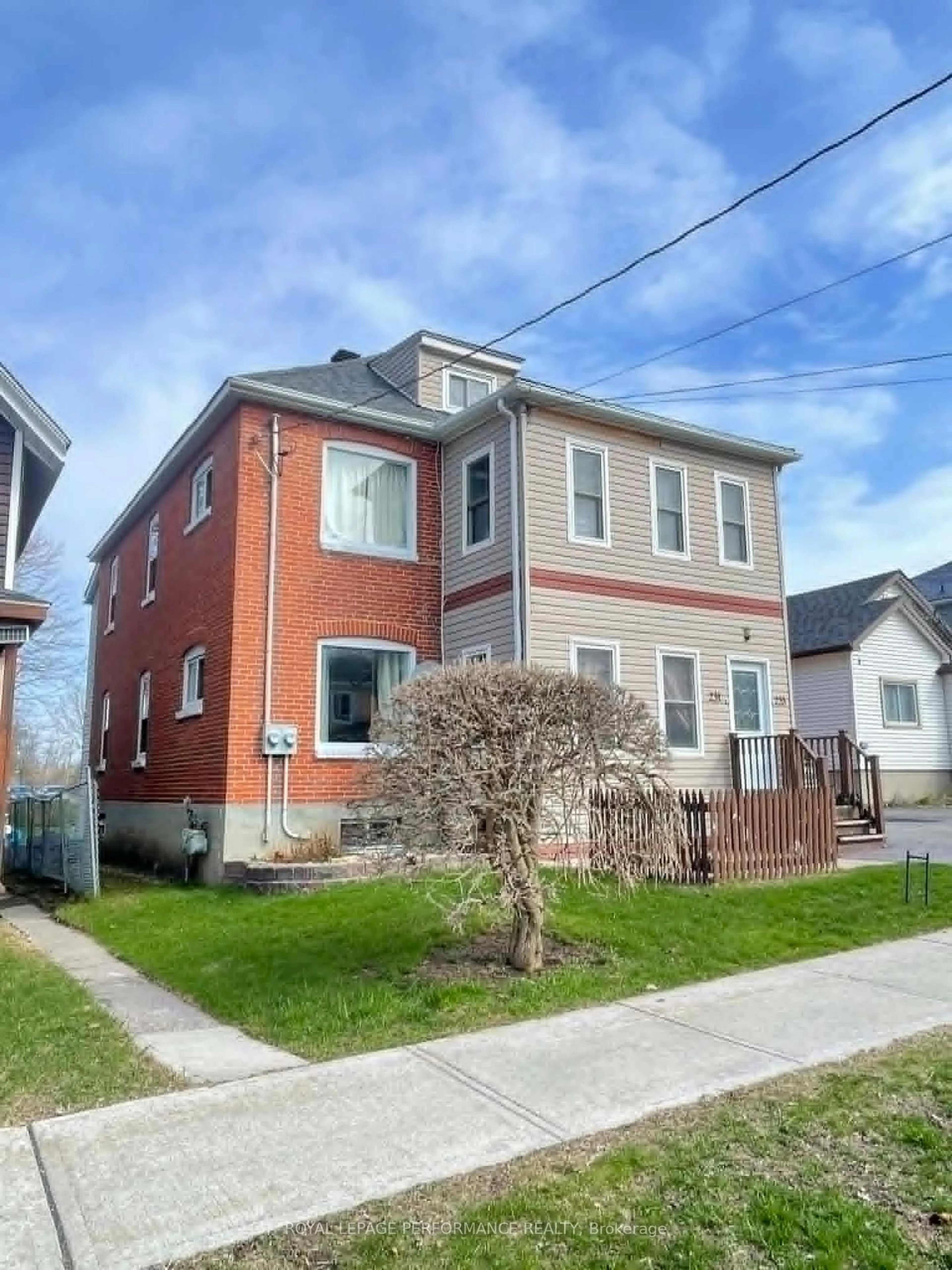 Home with brick exterior material, street for 231-233 Fifth St, Cornwall Ontario K6H 2L7