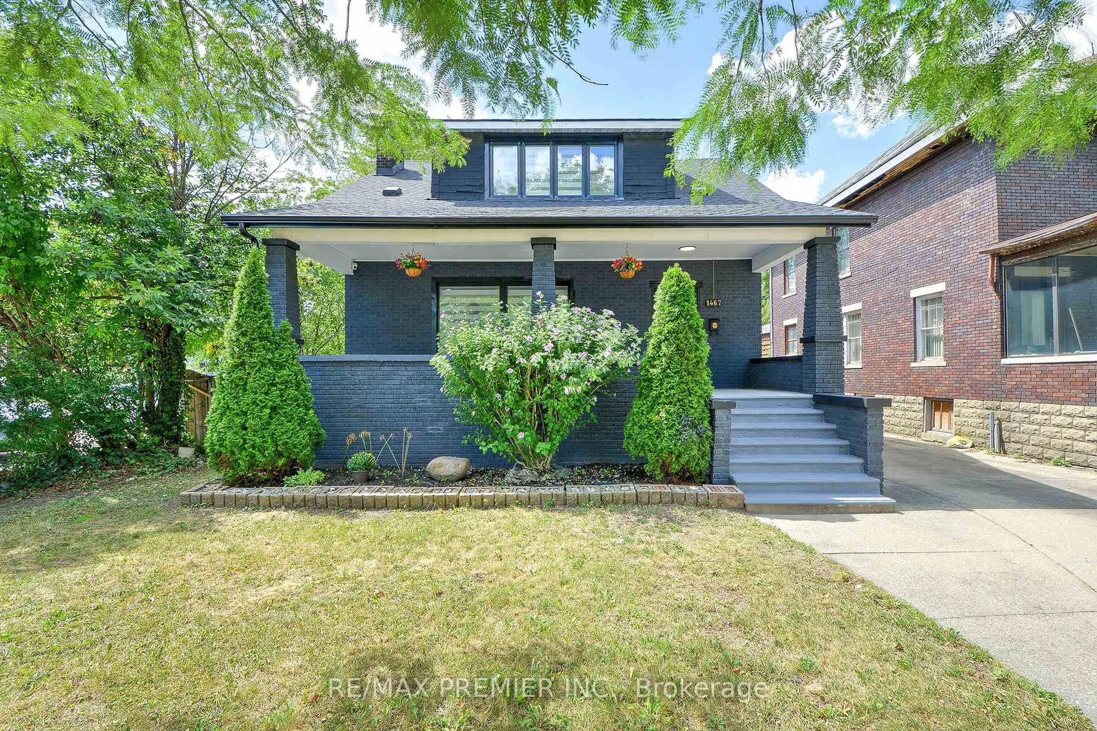 Home with brick exterior material, street for 1467 Ouellette Ave, Windsor Ontario N8X 1K1