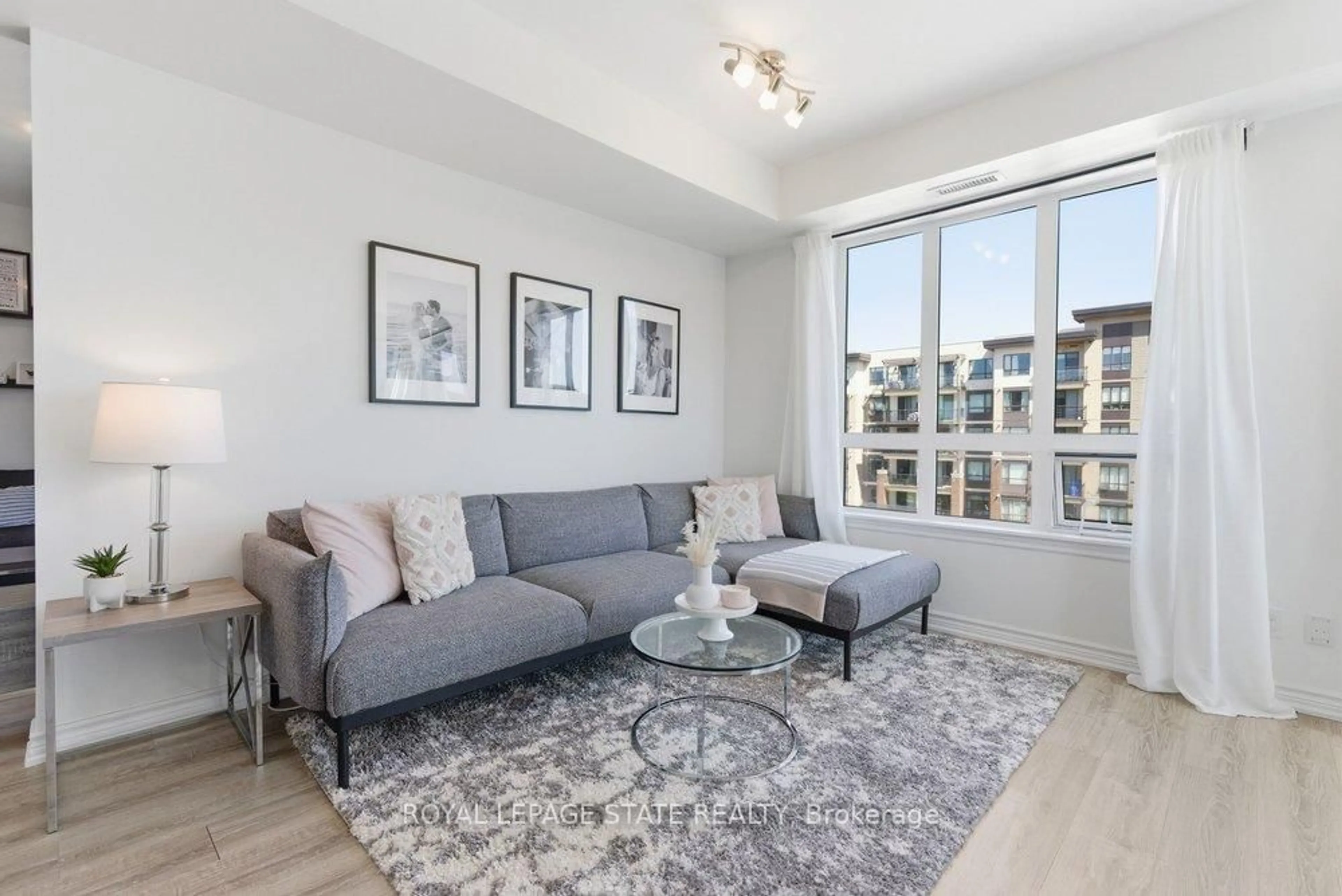 Living room with furniture, unknown for 40 Esplanade Lane #406, Grimsby Ontario L3M 0G9