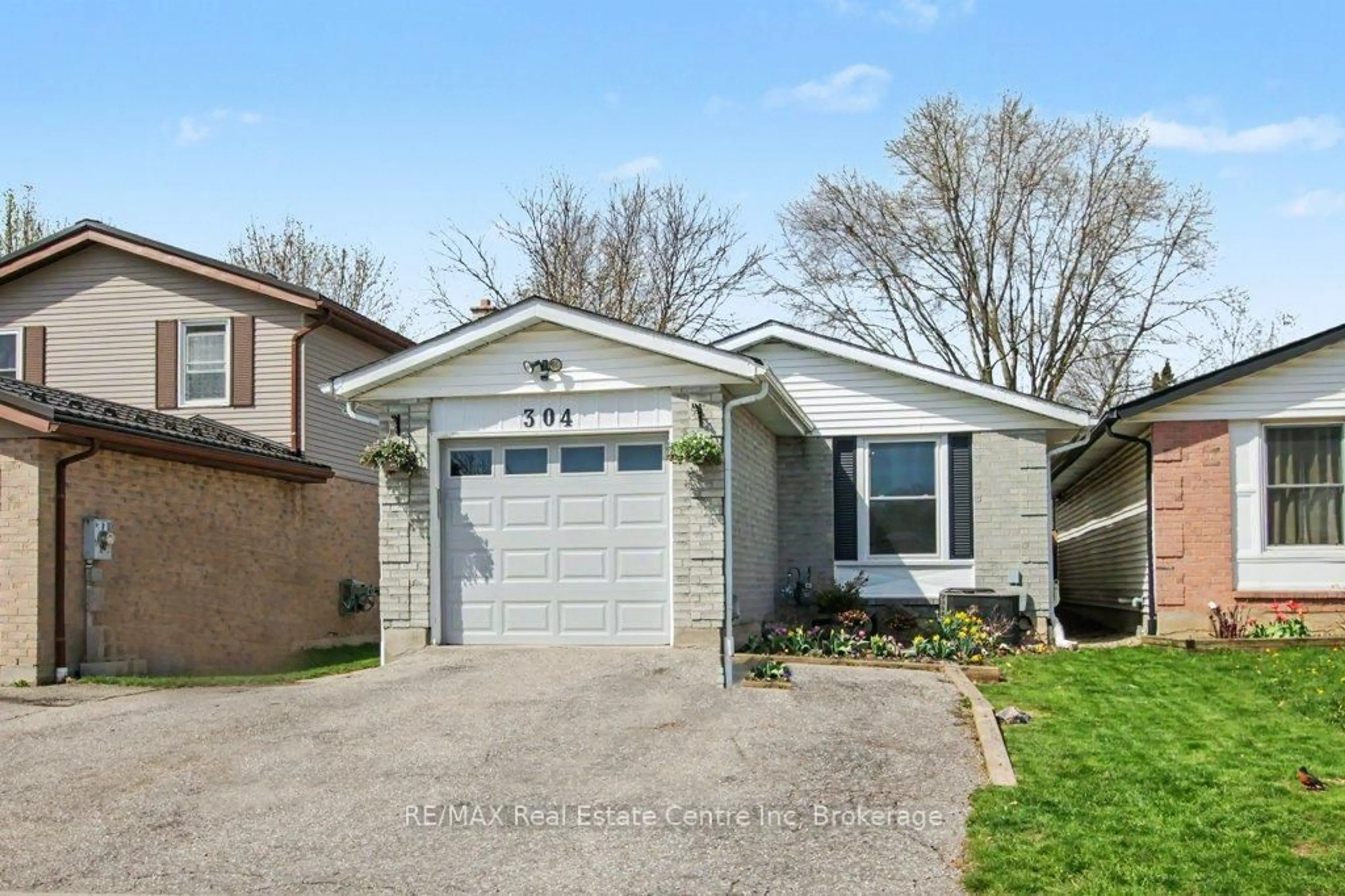 Home with vinyl exterior material, street for 304 Auden Rd, Guelph Ontario N1E 6S3