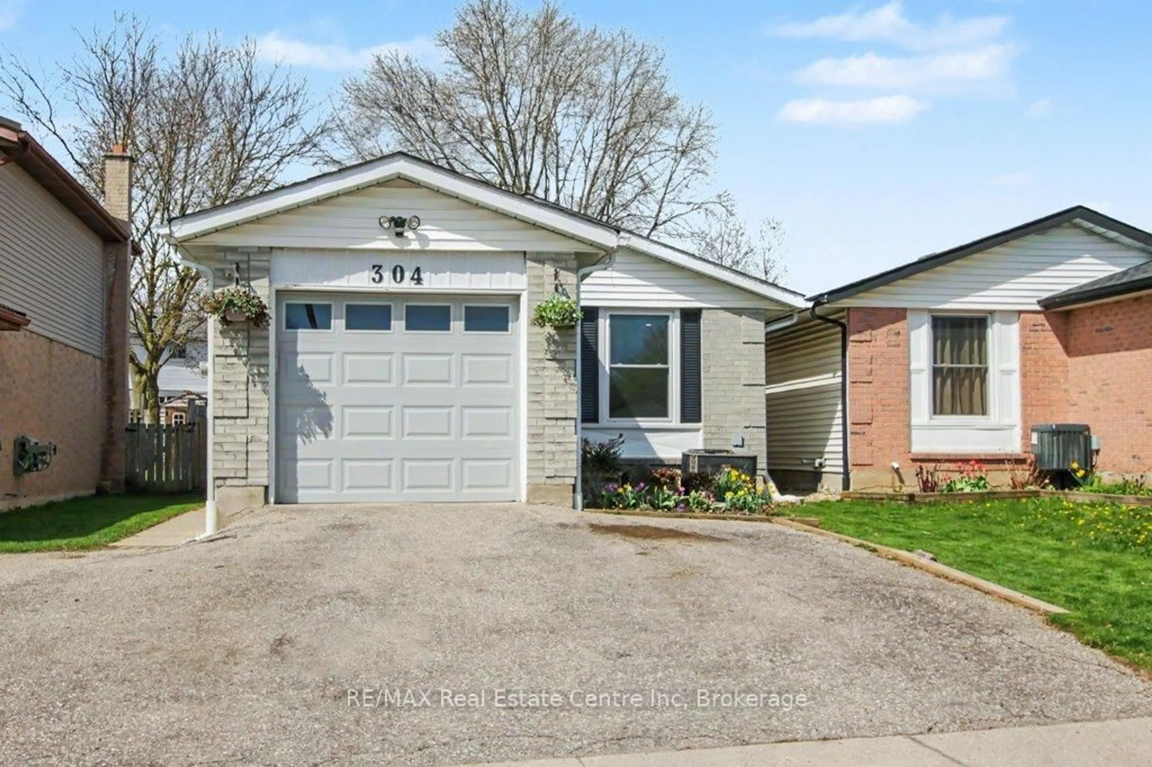 Home with vinyl exterior material, street for 304 Auden Rd, Guelph Ontario N1E 6S3