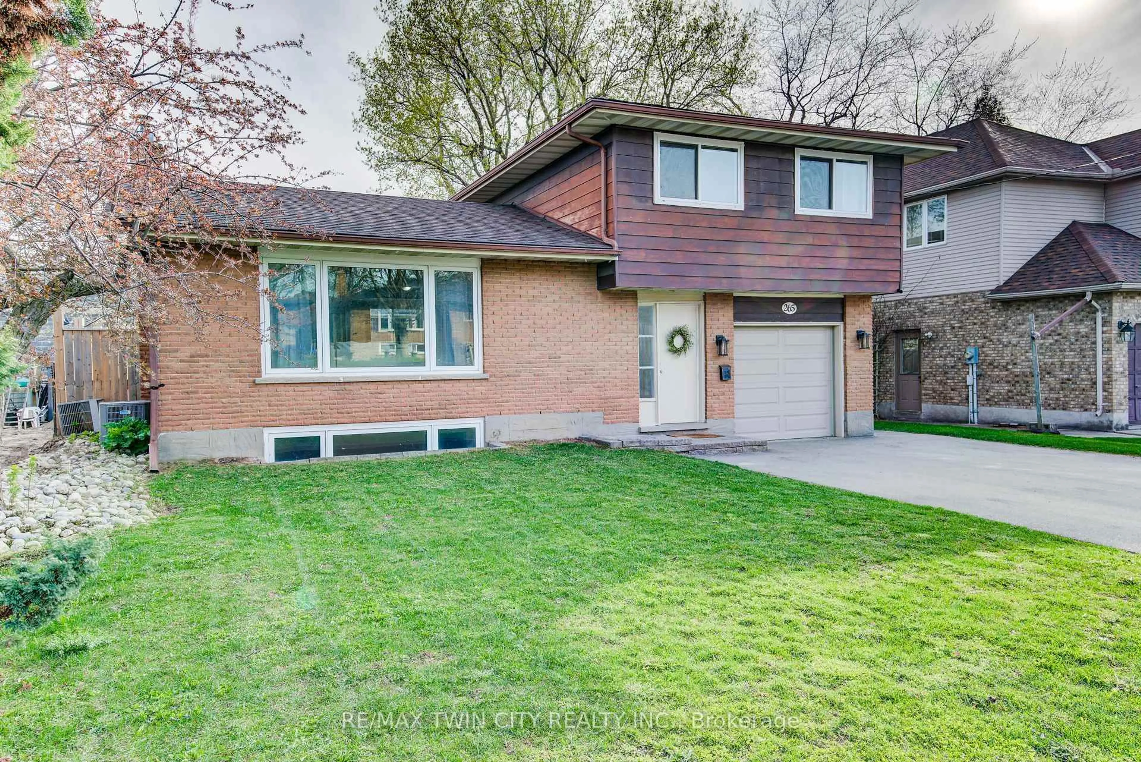 Home with brick exterior material, street for 265 Thaler Ave, Kitchener Ontario N2A 1R7