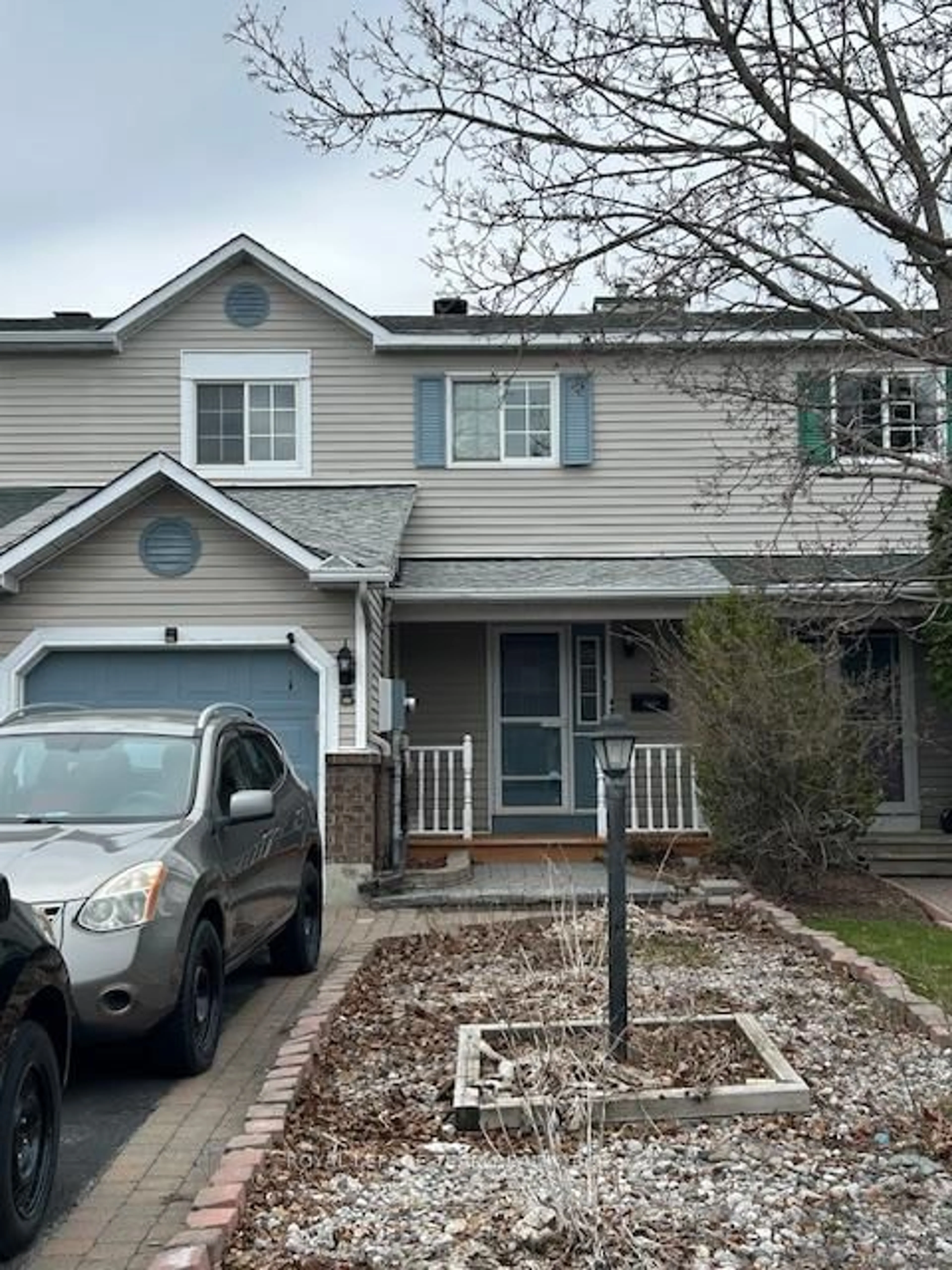 Home with vinyl exterior material, street for 57 Randall James Dr, Ottawa Ontario K2S 1L9