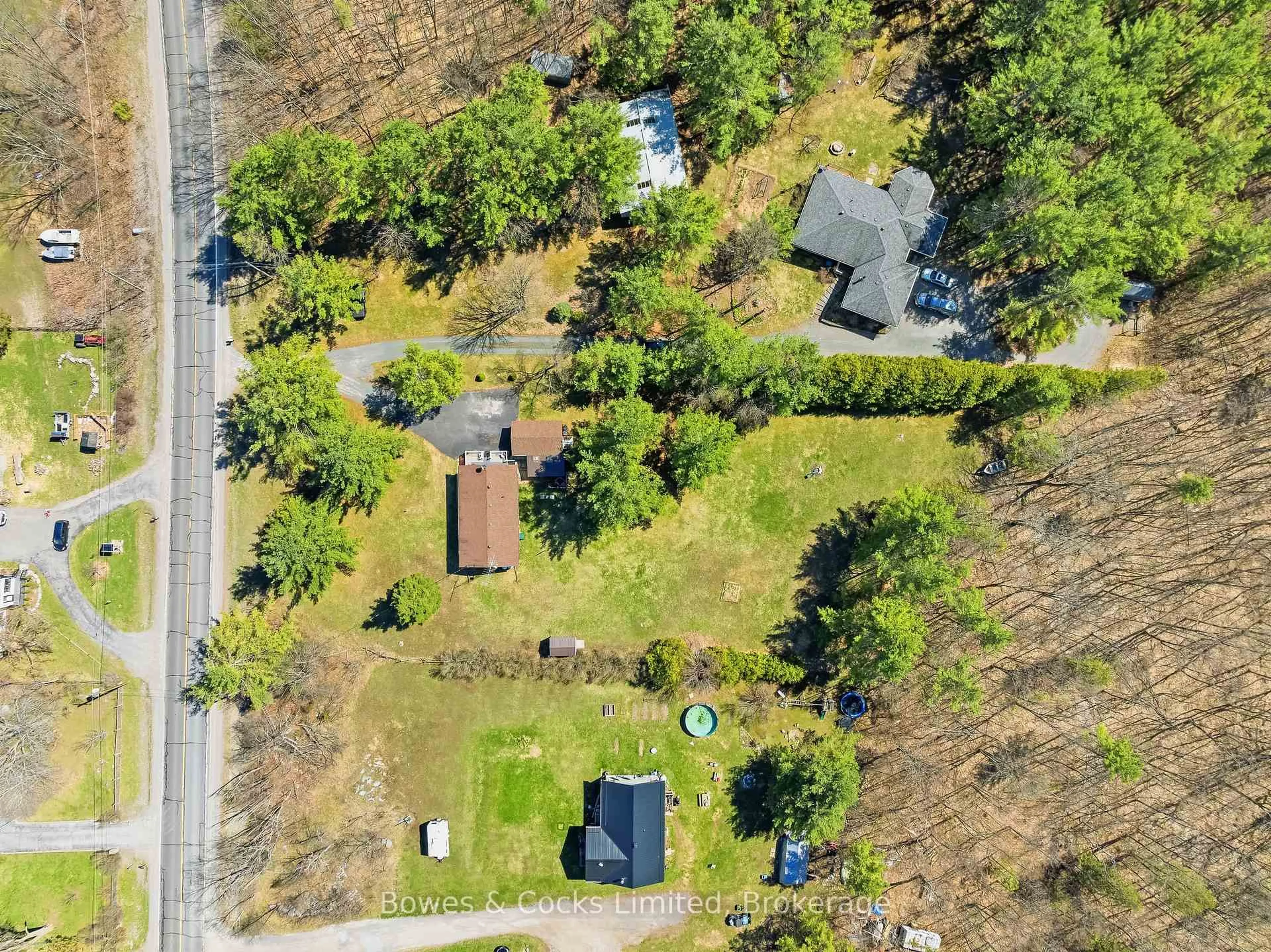 A pic from outside/outdoor area/front of a property/back of a property/a pic from drone, street for 1044 County Road 40, Douro-Dummer Ontario K0L 2V0