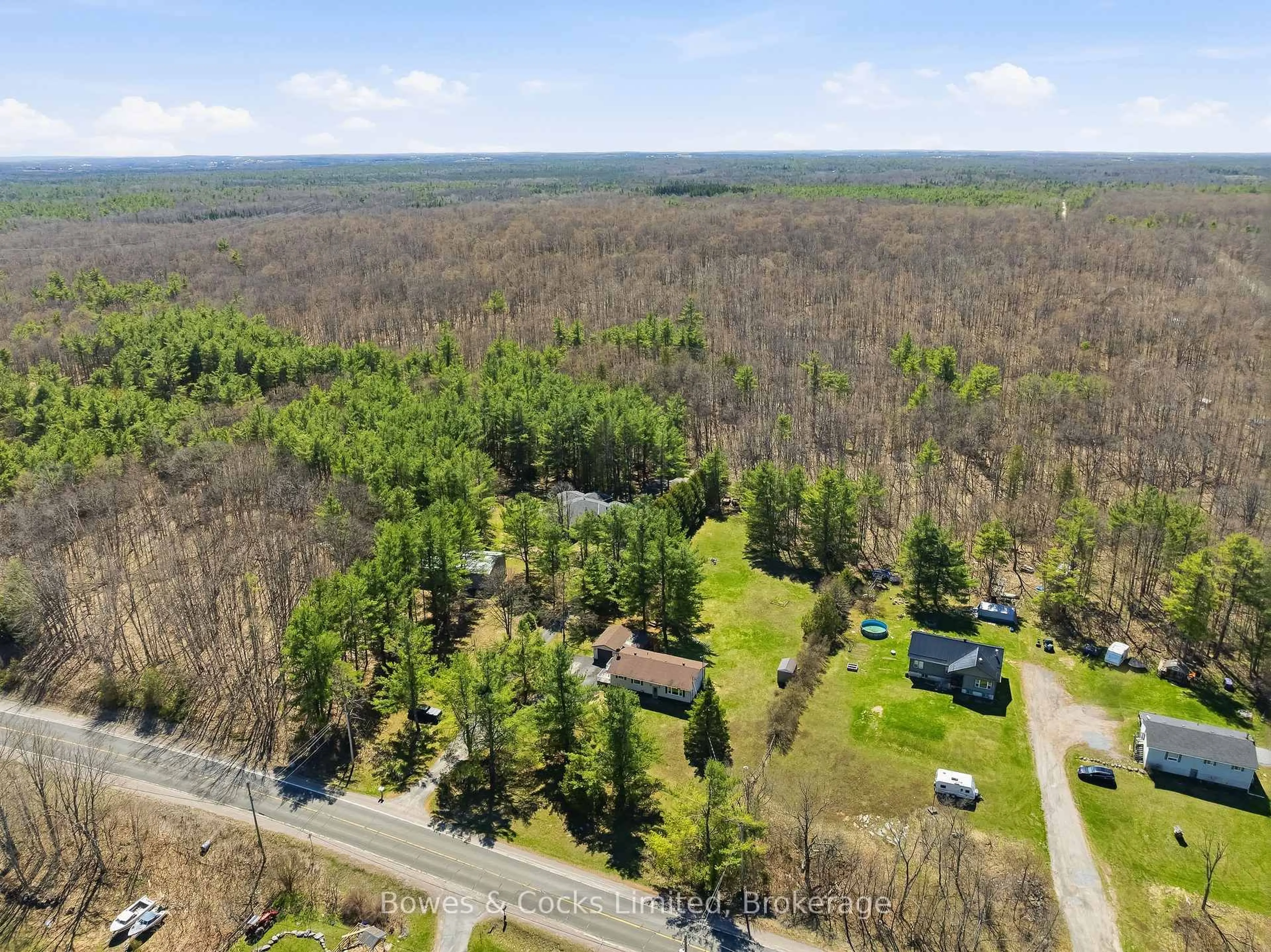 A pic from outside/outdoor area/front of a property/back of a property/a pic from drone, forest/trees view for 1044 County Road 40, Douro-Dummer Ontario K0L 2V0