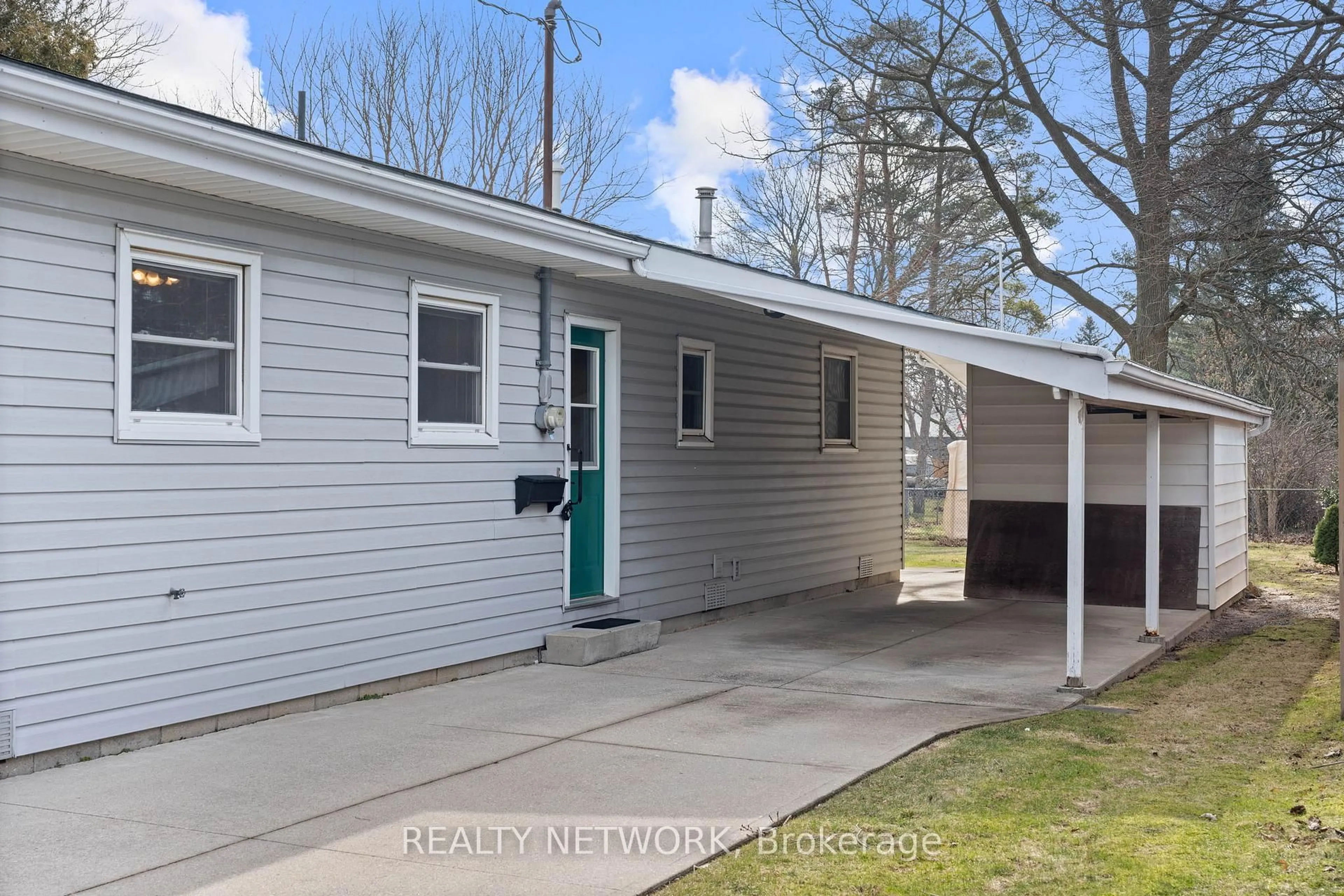 Home with vinyl exterior material, street for 1 Clifford St, Norfolk Ontario N0A 1N0