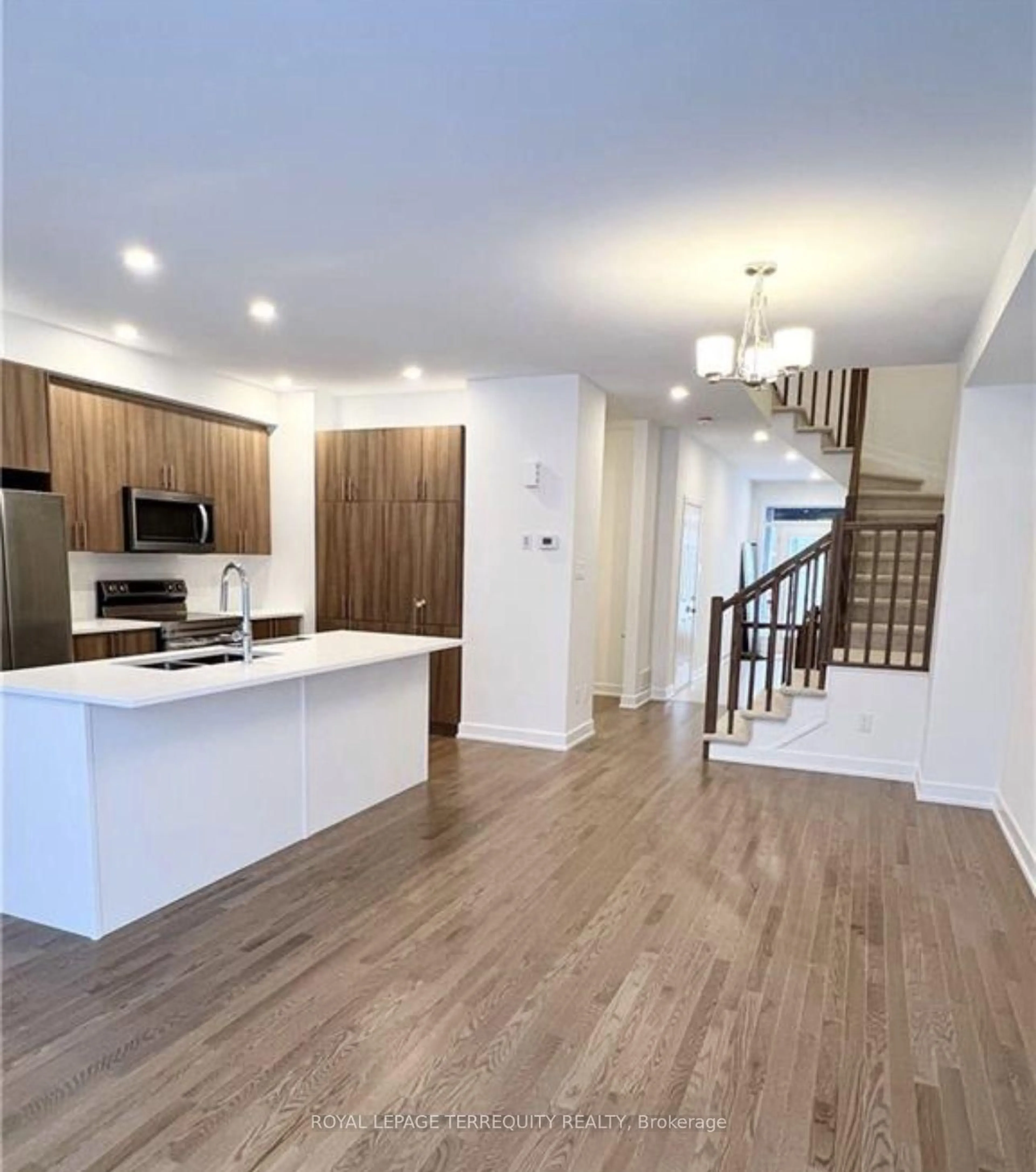 Open concept kitchen, wood/laminate floor for 74 Nettle Cres, Ottawa Ontario K1T 0W9