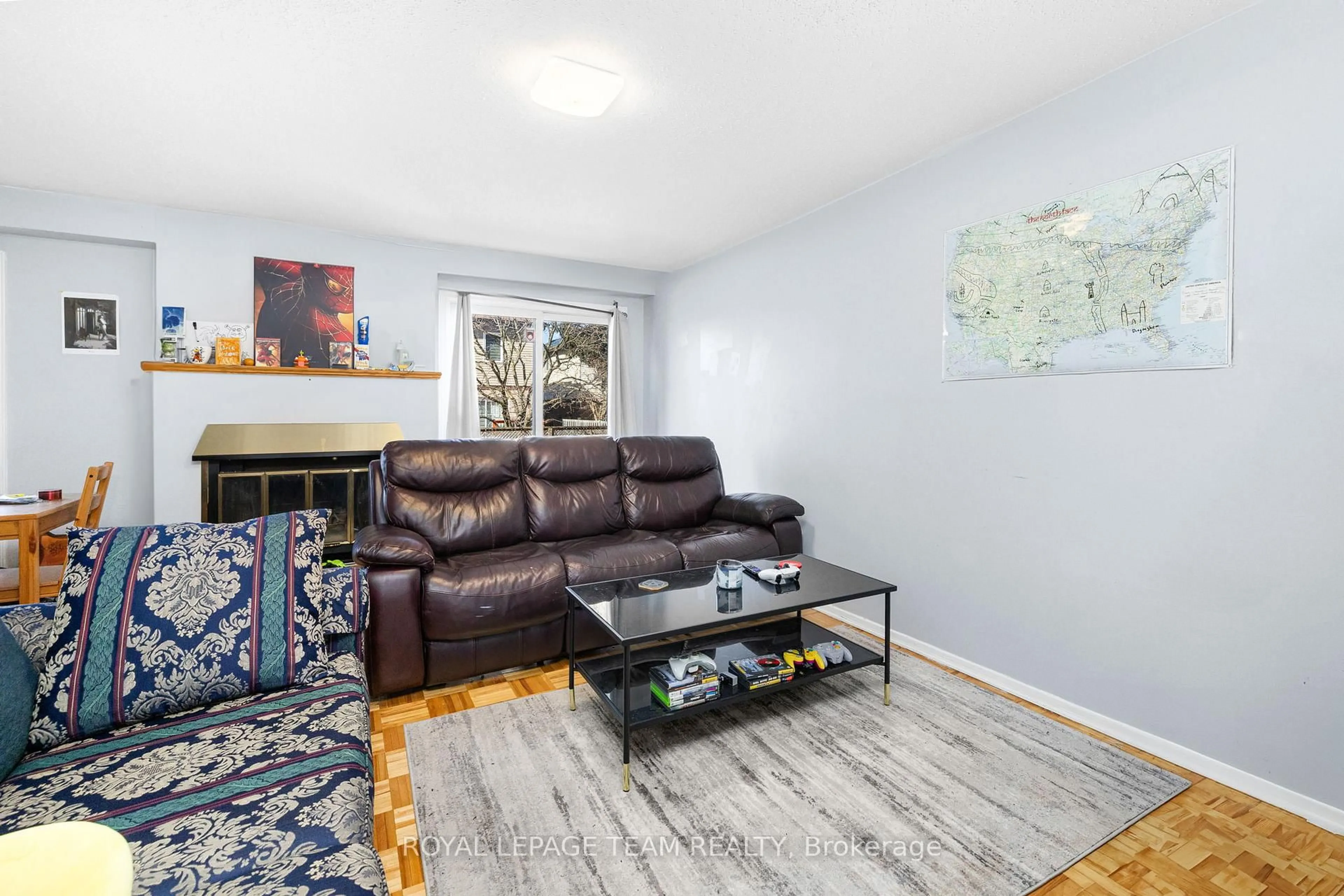 Living room with furniture, wood/laminate floor for 10 Millrise Lane #E, Ottawa Ontario K2G 5E6