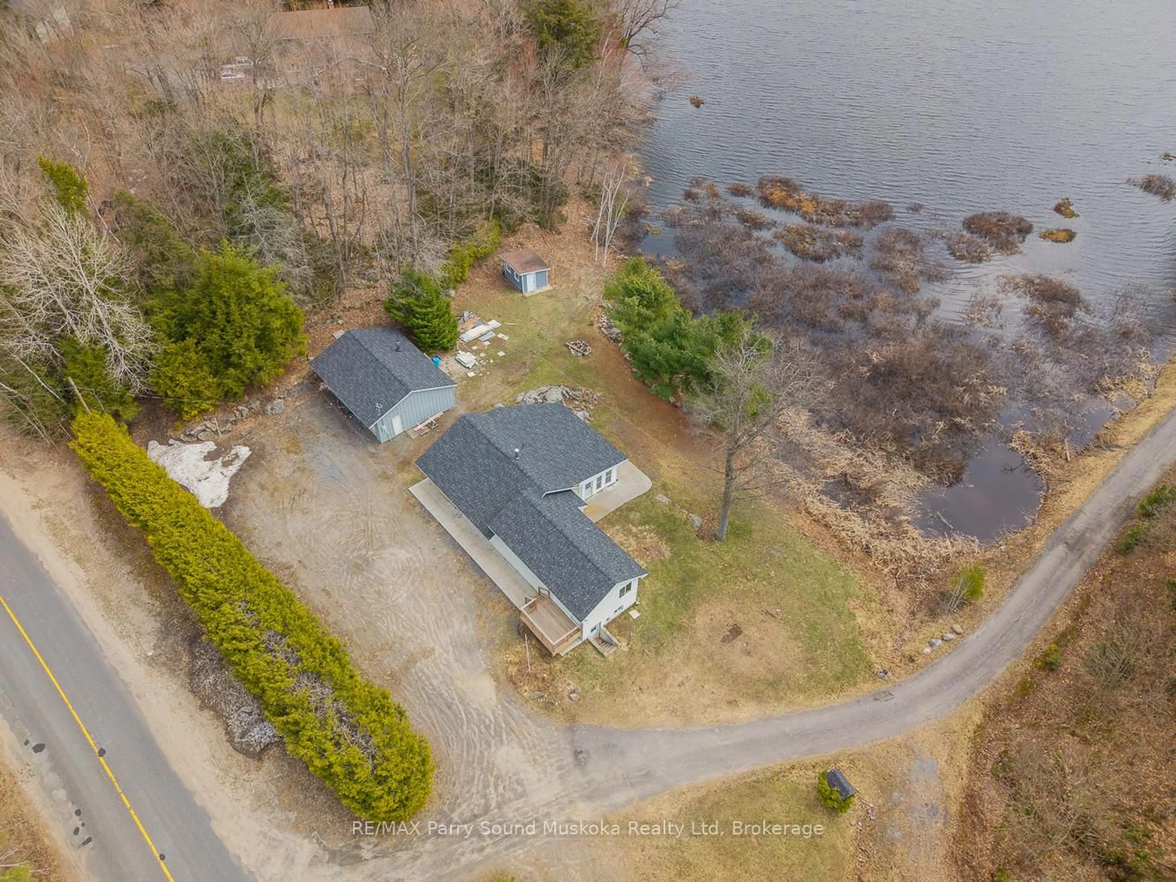 A pic from outside/outdoor area/front of a property/back of a property/a pic from drone, water/lake/river/ocean view for 92 Blue Lake Rd, Seguin Ontario P2A 2W8