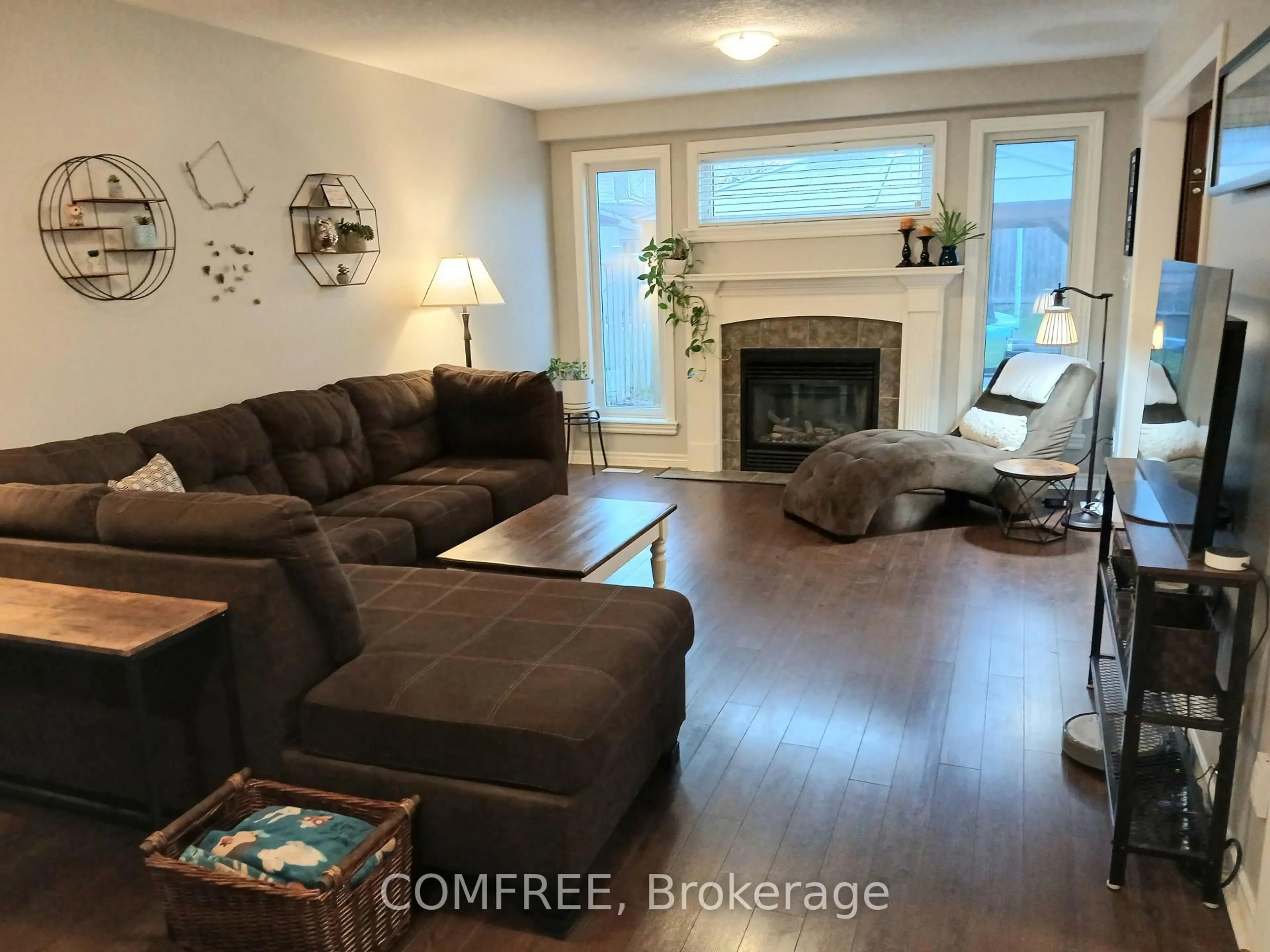 Living room with furniture, wood/laminate floor for 1192 South Wenige Dr, London North Ontario N5X 4M3